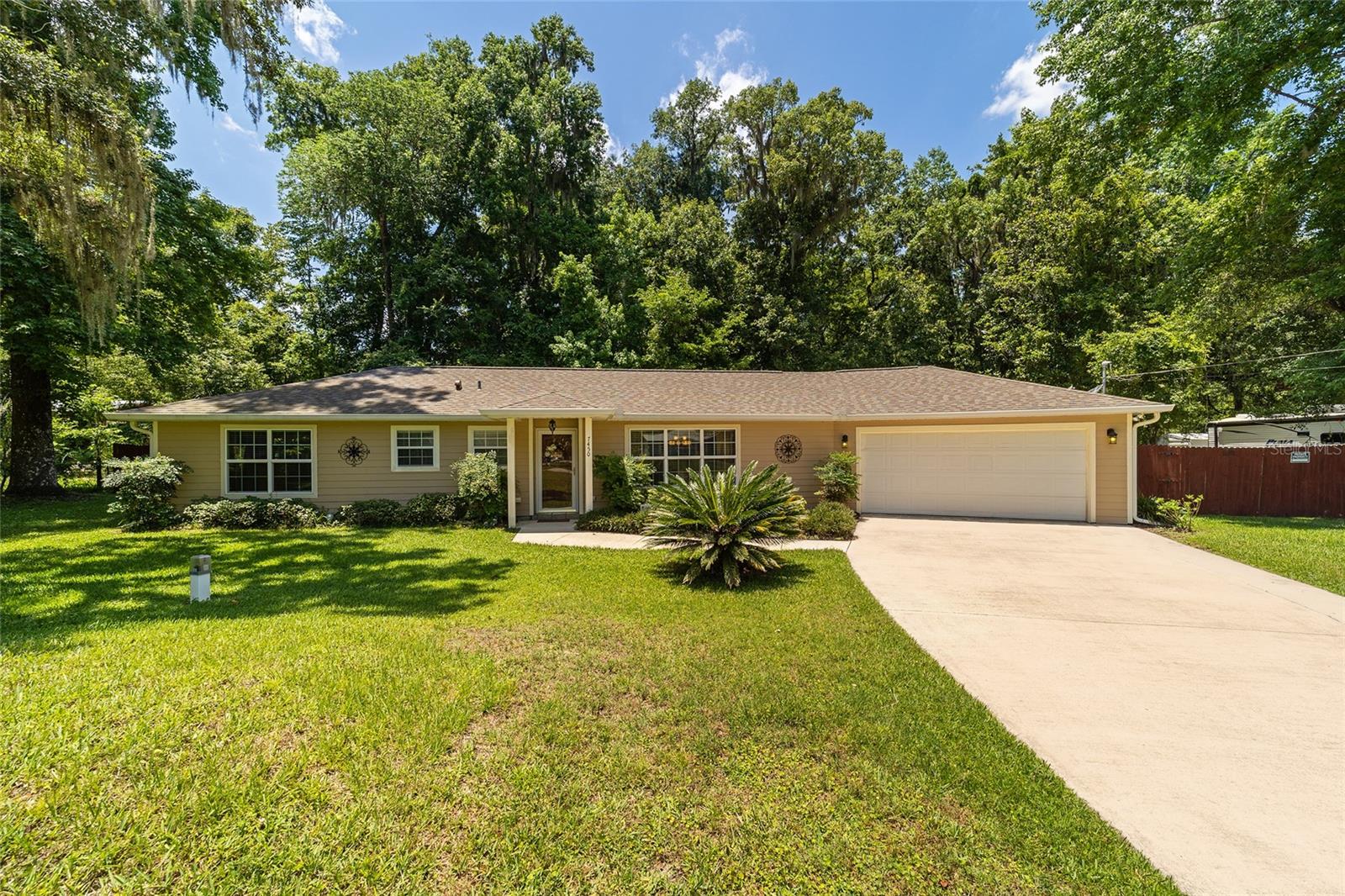 Meticulously kept 3 bedroom/2 bath home on almost a half of an acre in area where there is no HOA! Enter into the spacious family room and dining area with vaulted ceilings and laminate flooring, which carries into the kitchen. Kitchen, which was remodeled in 2016, with new appliances, cabinets and granite countertops, features a small breakfast bar and walk-in pantry. Master bedroom has walk-in closet and master bath has vanity with granite and walk-in shower. Two guest bedrooms share hall bath with vanity with granite and tub and shower combo. Step out of the family room onto the screened in porch that looks out over peaceful, private and spacious backyard. Roof was replaced in 2017 and HVAC unit is 2011.