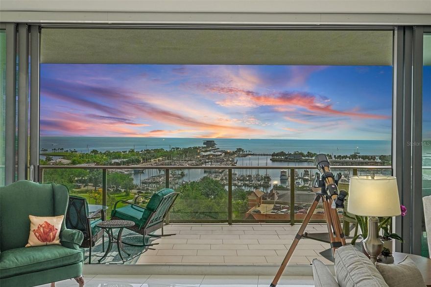 Exquisite Living with Stunning Water views at ONE St. Petersburg

Step into a world of unparalleled elegance and modern luxury with this stunning 3-bedroom + den, 3.5-bath corner condo at ONE St. Petersburg, one of the city’s most sought-after addresses. Spanning an expansive 2,475 square feet, this one-of-a-kind residence offers one of the largest floor plans available in the building, delivering the perfect combination of space, style, and breathtaking views.

From the moment you enter, you’ll be captivated by the seamless flow of the open-concept living spaces, enhanced by upgraded electrical receptacles and 24x24 porcelain tile throughout. The chef-inspired kitchen is a true masterpiece, featuring roll-out pantry shelves, sleek stainless steel appliances, a lazy Susan corner cabinetry for easy access, and a custom backsplash. The center island creates an ideal space for gathering and entertaining, while the separate bar area with additional cabinet space and built-in wine fridge elevates the home’s sophistication.

Throughout the living areas, custom built-ins and floating shelves add a touch of refinement, offering practical yet stylish storage solutions. All windows are equipped with electric blinds, and the master suite features blackout shades for ultimate privacy and comfort. With three private terraces, you’ll find the perfect outdoor retreat at every turn. Enjoy direct east-facing views of the tranquil waters from the main living area, soak in stunning west-facing city views from the guest suite and den, or unwind in the master suite, which boasts a private terrace with panoramic vistas of Tampa Bay, the new St. Pete Pier, and the marina.

This luxurious condo is not only beautifully designed but also comes with two parking spaces and a climate-controlled storage unit, ensuring your convenience and comfort. As a resident of ONE St. Petersburg, you’ll have access to an array of world-class amenities, including a 40,000-square-foot amenities deck featuring a 75-foot lap pool, cabanas, a luxurious spa, outdoor kitchens, fire pits, and abundant seating areas perfect for both relaxation and socializing. Inside, enjoy a state-of-the-art fitness center, a yoga studio, and exceptional social spaces, including a formal social room, game room, and club room—all complemented by the seamless concierge service.

Located in the heart of downtown St. Petersburg, ONE St. Petersburg offers immediate access to over 40 restaurants, museums, theaters, galleries, shopping, and the vibrant waterfront. Here, you'll discover a lifestyle where sophistication, convenience, and urban luxury come together effortlessly, perfectly encapsulating the essence of modern living in one of Florida's most dynamic cities.