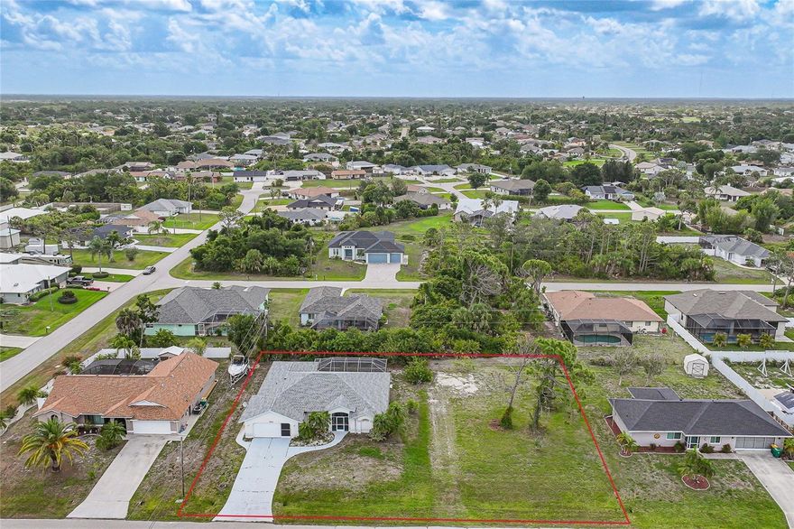 Welcome to this spacious Englewood pool home offering 3 bedrooms, 2 bathrooms, and 1,864 square feet of living space, perfectly situated on an oversized double lot that provides exceptional room to enjoy the Florida lifestyle. Surrounded by mature tropical landscaping, the property features a screened-in front porch, an attached two-car garage with a sliding screen panel, and a functional split-bedroom floor plan ready for your personal updates and finishing touches. Major improvements include a new roof in 2023, an A/C system installed in 2019, and a 40-gallon hot water heater replaced in 2018, offering added peace of mind for the next owner. This property is also not located in a flood zone and is not part of an HOA or CDD community. Step through the foyer into a spacious living area highlighted by soaring cathedral ceilings, wood laminate flooring, and sliding glass doors that open to the screened-in pool and lanai—creating an effortless indoor-outdoor flow ideal for entertaining or relaxing in true Florida style. Adjacent to the living room, the dedicated dining area provides a comfortable setting for both everyday meals and special gatherings. The generously sized eat-in kitchen is the heart of the home, featuring a full suite of appliances, tile flooring, a cozy breakfast nook, and abundant cabinet and drawer storage. A wraparound breakfast bar comfortably seats four and overlooks the main living area, enhancing the open-concept design and making it easy to stay connected while cooking or entertaining. Crisp white cabinetry with modern black hardware pairs beautifully with a stylish mosaic tile backsplash, while expansive counter space ensures everyday functionality. Conveniently located just off the kitchen, the well-appointed laundry area offers a washer and dryer, utility sink, and additional storage space. The primary suite serves as a peaceful retreat with private pool access, a generous walk-in closet, and an ensuite bathroom featuring dual vessel sinks atop a crisp white vanity with ample storage. The spacious walk-in shower showcases contemporary tile accents and is complemented by a built-in soaking tub. Two additional bedrooms, each with built-in closets, share a well-appointed full bathroom. Outside, your private backyard oasis awaits. The screened-in pool and expansive deck feature a covered lanai with ceiling fans, providing a comfortable shaded space perfect for relaxing or entertaining year-round. This outdoor retreat offers the ideal setting to unwind and enjoy the Florida sunshine in comfort and style. Ideally located near Rotonda West, residents enjoy access to five golf courses, scenic walking and biking trails, boating and fishing opportunities, and are just a short drive to pristine Gulf beaches, shopping, and dining—offering the very best of Florida lifestyle living.
**PLEASE ENJOY THE 3D INTERACTIVE VIRTUAL TOUR ASSOCIATED WITH THIS LISTING**