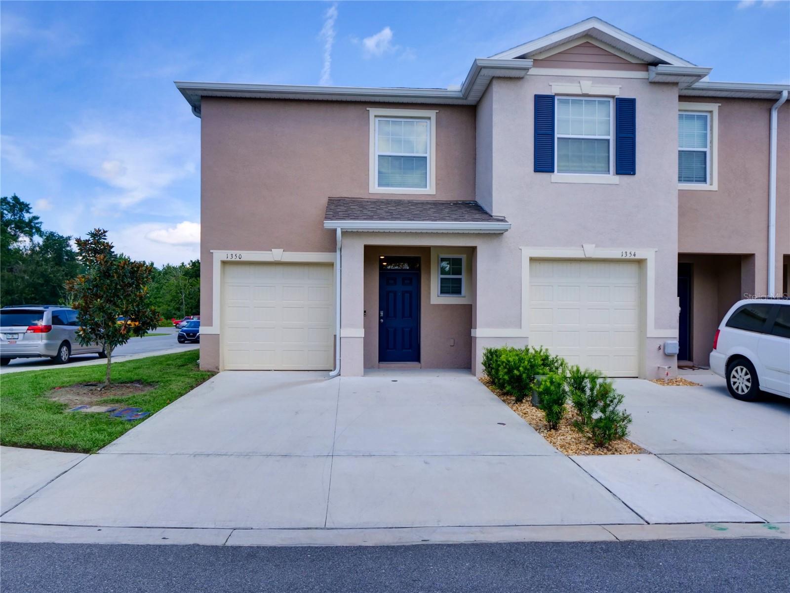 Beautiful End Unit Townhome in Gated Community! Welcome to this 3-bedroom, 2.5-bath, 1-car garage end unit located in the exclusive, manned gated community of Atria. The open-concept floor plan features a spacious living and dining area, a modern kitchen with stainless steel appliances, and a convenient half bath on the first level. Upstairs, you'll find all three bedrooms, including a generous primary suite, along with two full bathrooms and a laundry area with washer and dryer included. As an end unit, this home offers added privacy and additional side parking. Located just across from the community playground, you'll love the tranquil views of the conservation area. This pet-friendly community also features Smart Home technology for modern convenience. Home Warranty included! Enjoy life in a golf community close to shopping, dining, Disney, Legoland, and more. Don’t miss out—schedule your showing today and make this home yours!