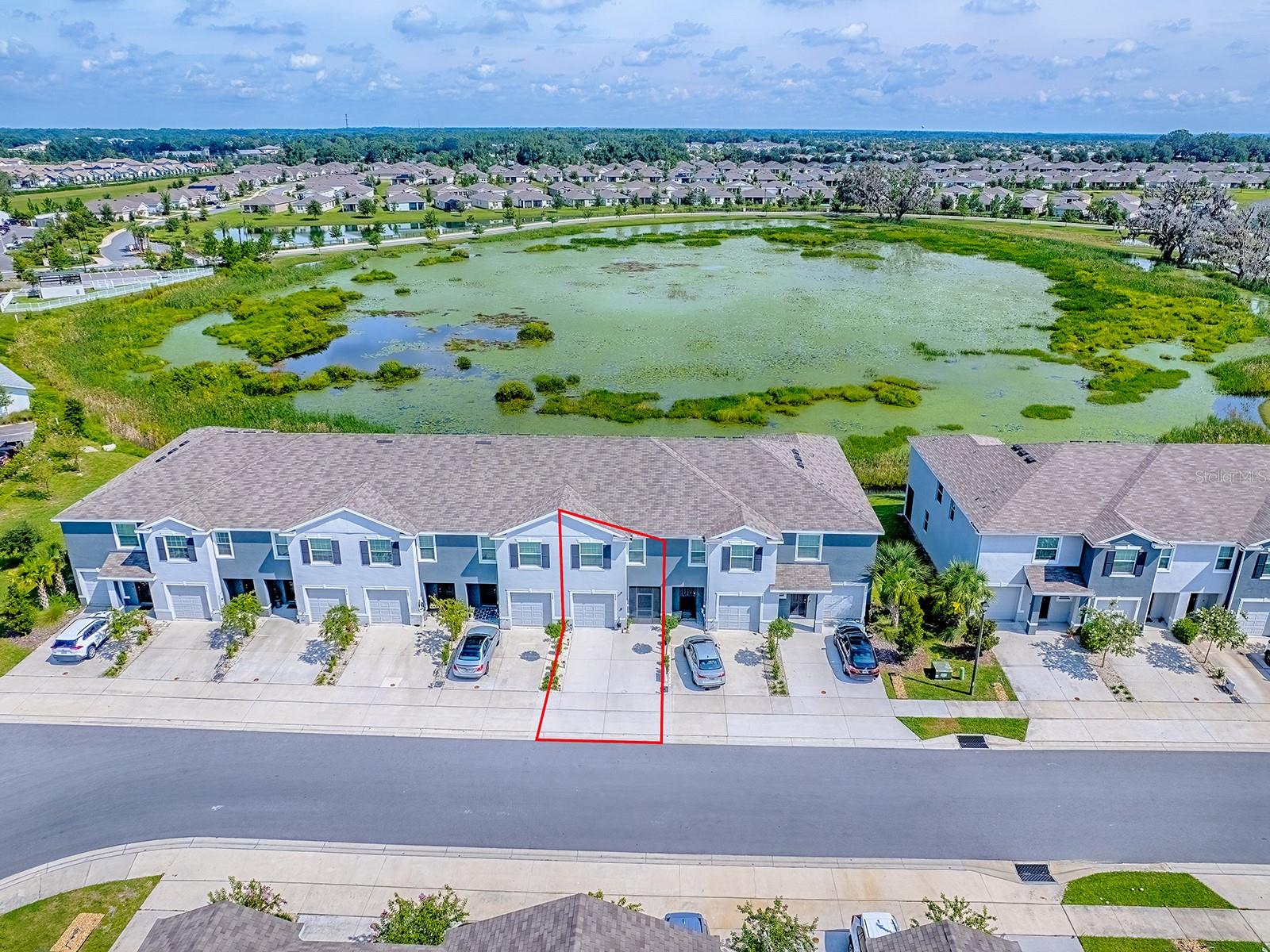DIRECT WATERFRONT LOW MAINTENANCE BETTER-THAN-NEW TOWNHOME.
Welcome to paradise! Experience the beauty of Florida’s natural wildlife with the convenience of proximity to The Villages in this direct waterfront townhome. This home is SPOTLESS and has been meticulously maintained and occupied by its original owners. Upon entering this home you will enjoy an open concept first floor with elevated ceilings coupled with breathtaking water & wildlife views. The first floor features a spacious kitchen with granite counters and barely used kitchen appliances, the living room, dining nook, and powder room, along with access to the generously tall one car garage. Both the front patio and large rear lanai have been screen enclosed and tiled for comfort and privacy. The oversized backyard has been beautifully landscaped, featuring an extended paver walkout with river rock & retaining brick to accent, magnolia tree and tropical foliage. The rear yard was re-sodded with zoysia grass in 2024. Upstairs you will find the master suite with dual closets for plenty of storage, master bathroom which features dual sinks along with a shower enclosed with a premium Kohler spot-resistant door (installed 2024.) You will also find both generously sized guest bedrooms, one of which features a walk in closet. Steps away from the bedrooms are the guest bathroom and the laundry room.
This home has been painted throughout this year. Tile throughout first floor, well-maintained carpet on the second floor (tile in bathrooms.) Smart-home ready. TV mounts and cable management systems installed in all rooms including the garage and lanai. Remote controlled, dimmable fans installed throughout in 2024. Front patio & rear lanai tile completed 2024, screen enclosures added 2023/24, rear lanai has Coolaroo solar shades (2024). Gutters installed in the front and rear of the home in 2023/24 (rear has french drains.) All appliances and A/C have been serviced and maintained (new from 2023, stove has never been used.)
HOA and CDD cover roof replacement, exterior painting, common area insurance, landscape/lawn maintenance with irrigation, along with the pool, cabana, and mail-center. The Beaumont Townhomes are built with concrete block all the way up to the second floor and between units with injected fire resistant insulation to ensure safety and privacy.
Just minutes away from all the shopping, dining, and entertainment of The Villages. Located within the high ranking Sumter County School District, home to the A-Rated Villages Charter School. This home is ready for you to move in! You can’t find better; call for a showing today!!!