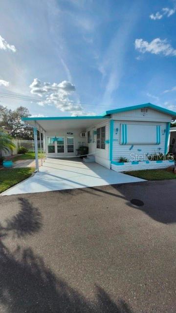 Ask about the 2011 Equinox!! Move in ready home in Bradenton Tropical Palms. A gated, age restricted community with a low monthly fee!. The home offers one bedroom one bath with a newly enclosed Florida room. Utilized currently as a second living room, could easily be a art/craft room or 2nd bedroom. Home comes fully furnished! The community offers a wealth of amenities, including a huge 60 x 40 heated pool, fitness center, library/card game room, and a clubhouse complete with indoor pickleball courts. The clubhouse also features a stage for entertainment, large enough for theater productions, and a new top-of-the-line professional kitchen for community dinners. For those who enjoy games, there is a community shuffleboard league with 22 shuffleboard courts. Golf enthusiasts will appreciate the community golf group and the presence of over 30 golf courses within a 30-minute drive. You can relax and read in the gazebo or enjoy the tranquility of the memorial garden and beautifully landscaped walkways. Lecom Park is just a short walk from Bradenton Tropical Palms, where you can catch the Pittsburgh Pirates' spring training games and watch the Bradenton Marauders in the off-season. Shopping and waterfront restaurants nearby. The Bradenton/Sarasota airport is only 20 minutes away. Tampa airport is approximately 45 minutes for easy commuting during snowbird season. Come see this beauty for yourself!!