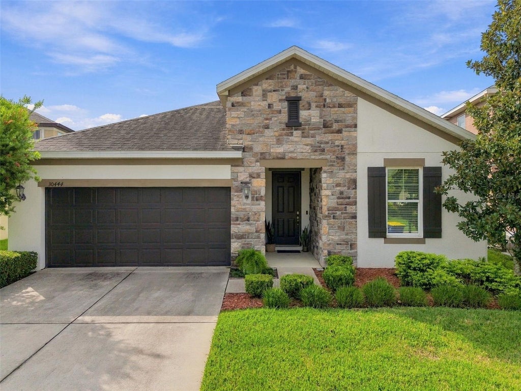 Photo of 30444 Pecan Valley Loop, Wesley Chapel, FL 33543 (MLS # TB8550017)