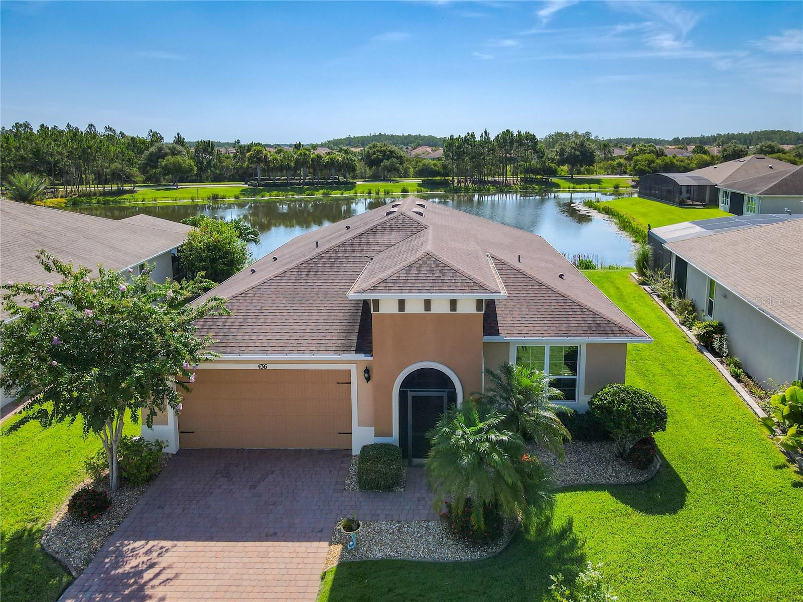 Welcome Home to 436 Bel Air Way, a Stunning Calabria Model Home located on a quiet cul de sac in the Verona neighborhood of Solivita. Built in 2016 with a Beautiful Eastern Waterfront View from your EXTENDED lanai and Amazing Sunset Views your front porch. This model has 1,975 Sq Ft of Air Conditioned Living Space with 2 Bedrooms, 2 Baths, and a large Study. Great curb appeal with a screened front porch, enhanced landscaping, river rock and landscape curbing. The Lanai is Covered and Screened and Offers amazing Sunrise Views over the Pond. The Primary Suite is spacious and includes a Walk-In Closet, a large Ensuite Bath complete with a glass surround walk-in shower and dual sinks with a large vanity. The home is Open and Modern and offers a generous foyer and a large Great Room open to the Kitchen and Dining Room. The Kitchen features 42” staggered cabinets, stainless appliances, a walk-in pantry and granite island perfect for casual dining or entertaining. The split floorplan, with the Study and the Guest Bedroom separate from the Primary Suite, offers privacy for both the owner and overnight guests. Recessed lighting in the Kitchen and Great Room and tile floor throughout the public spaces with carpeting in the bedrooms, water view from the Kitchen, Great Room, Dining and Primary Suite. The Den has atrium doors and can be used as a third bedroom as needed. This home is well maintained with a transferrable termite bond in effect. Solivita is an Award Winning, Master Planned and Gated 55 Plus Golf Cart Community in Central Florida. 4,300 acres of pure luxury with ponds, conservation, 2 18 Hole PGA Golf Courses, tennis and pickleball courts, 14 temperature controlled pools, 2 State of the Art Amenity Centers complete with trainers, classes and the latest equipment. Play softball, horseshoes or bocce ball. Solivita has something for everyone! Our Downtown Village Center has restaurants, activities, a hometown pharmacy/sundries store, library, art studio, meeting rooms, and a pro shop. Enjoy top notch entertainment in the ballroom or take a class or a seminar at Solivita University. Ride your golf cart to the park, enjoy the butterfly garden or grow veggies in the community garden. You can take at golf lesson at Stonegate Golf Club, drive balls at our aquatic driving range or take your “best friend” to the dog park. Join any of over 200+ clubs, visit with friends and neighbors. The HOA maintains the landscaping and irrigation throughout the community, provides security, maintains the roads and includes fiber optics for internet and television. Across the street from the main entrance are a hospital, medical offices and Poinciana Plaza with TJMAXX, Ross, Ulta Beauty, 5 Below, First Watch, Outback Steakhouse, Coldstone Creamery and more! Solivita is 45 minutes to all the attractions and a great place to live. Don’t wait…schedule an appointment to see this home today and start enjoying the Solivita Lifestyle!