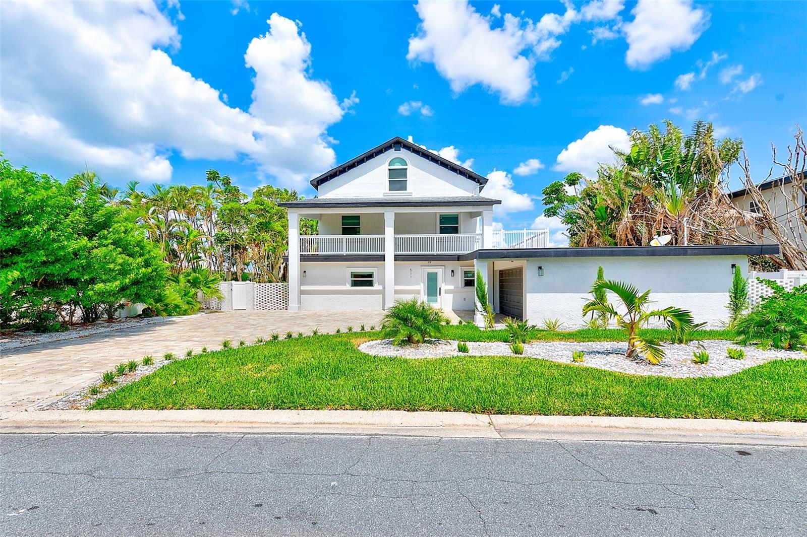 Welcome to your dream waterfront home—an expansive, beautifully upgraded residence offering the perfect blend of comfort, style, and tranquil coastal living! Some photos in this listing have been virtually staged. This residence features 4 spacious bedrooms, each with its own private en-suite bathroom. The enormous 3rd floor loft space is ideal for a home office, media room, or stunning bedroom with water views and en-suite bath. The 2nd floor primary suite offers true retreat-style living with two large walk-in closets and a luxurious, spa-like bathroom with soaking tub and separate shower. Enjoy the fresh feel of a brand-new kitchen and completely renovated bathrooms, designed with modern finishes and high-end touches throughout. The home also boasts new imported tile flooring, high ceilings, and hurricane-rated windows and doors for peace of mind and efficiency. A brand-new A/C system ensures maximum year-round comfort.
Step outside and embrace the Florida lifestyle with a private pool, outdoor dining area, and a spacious second-story deck overlooking the water. Take in breathtaking, unobstructed water views from both the front and back of the home, and enjoy direct water access with your own 28’ boat lift—perfect for boaters and water lovers. The newly updated landscaping adds curb appeal and privacy, completing this exceptional waterfront offering. Don’t miss your chance to own this one-of-a-kind property—luxury, space, and location all in one!