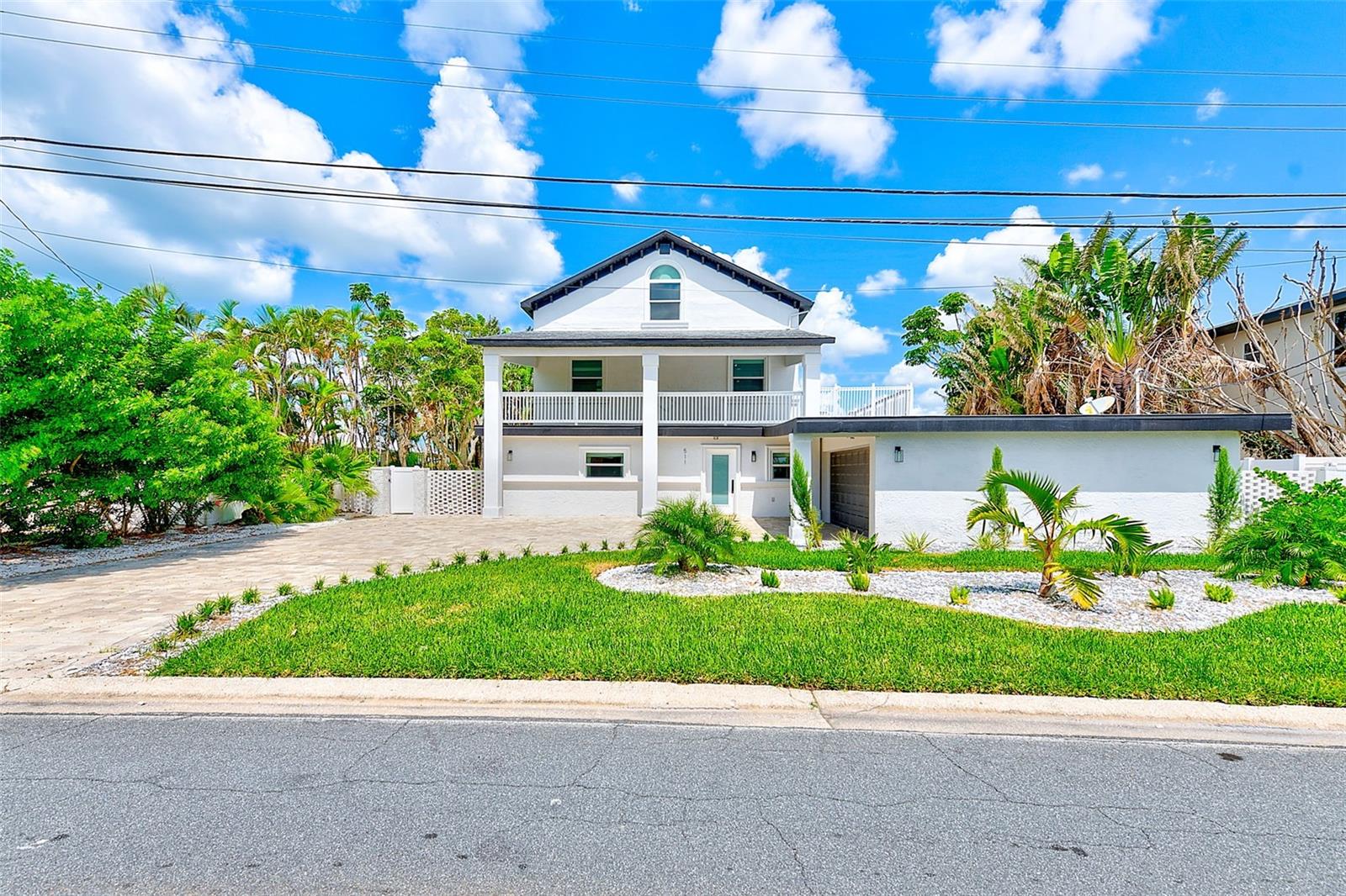 Welcome to your dream waterfront home—an expansive, beautifully upgraded residence offering the perfect blend of comfort, style, and tranquil coastal living! Some photos in this listing have been virtually staged. This residence features 4 spacious bedrooms, each with its own private en-suite bathroom. The enormous 3rd floor loft space is ideal for a home office, media room, or stunning bedroom with water views and en-suite bath. The 2nd floor primary suite offers true retreat-style living with two large walk-in closets and a luxurious, spa-like bathroom with soaking tub and separate shower. Enjoy the fresh feel of a brand-new kitchen and completely renovated bathrooms, designed with modern finishes and high-end touches throughout. The home also boasts new imported tile flooring, high ceilings, and hurricane-rated windows and doors for peace of mind and efficiency. A brand-new A/C system ensures maximum year-round comfort.
Step outside and embrace the Florida lifestyle with a private pool, outdoor dining area, and a spacious second-story deck overlooking the water. Take in breathtaking, unobstructed water views from both the front and back of the home, and enjoy direct water access with your own 28’ boat lift—perfect for boaters and water lovers. The newly updated landscaping adds curb appeal and privacy, completing this exceptional waterfront offering. Don’t miss your chance to own this one-of-a-kind property—luxury, space, and location all in one!