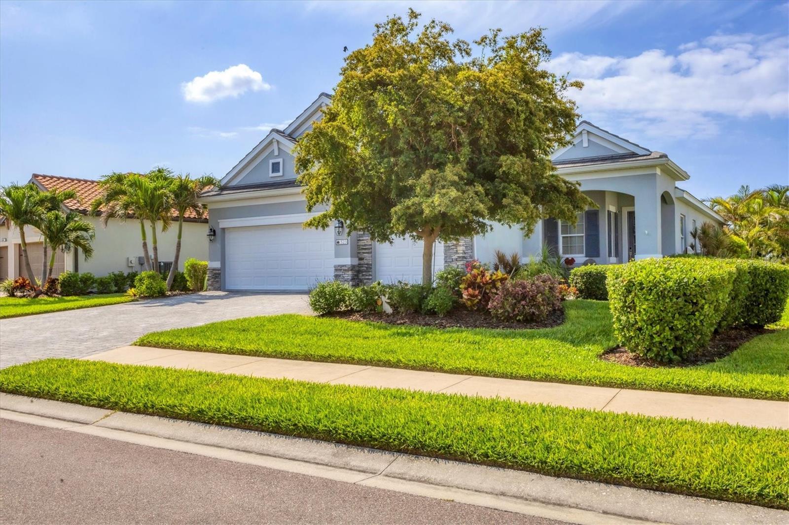 Amazing opportunity to own an exceptionally appointed 3 bedroom pool home in the exclusive gated community of The Estuary in NW Bradenton. This beautiful home, built in 2018, is a Neal Communities Sea Mist model with a French Country exterior and a beautiful lake and preserve view. Upon entering the home you will be impressed with the elegant foyer, overlooking an open great room plan with wood-look tile floors, volume ceilings, and floor to ceiling sliding glass doors. The spacious kitchen is open to a great room and features solid wood cabinetry, stainless steel GE Monogram gas appliances, tile backsplash, quartz countertops, & walk-in pantry with wood shelving. For entertaining guests, there is also a dry bar with a wine cooler. Another beautiful feature is the elegant stained-glass windows that are in the dining area overlooking the stone surrounded fireplace on the lanai. The master bedroom is spacious and a relaxing retreat with dual walk-in closets and a lovely bathroom with dual sinks and a walk-in shower. All this looks out over a large, screened lanai with heated saltwater pool. Relaxing around the pool is a breeze with multiple sitting areas that can accommodate a large group or just have a quiet evening at home around the stone surrounded fireplace. There are two additional guest bedrooms featuring a jack and jill bath. Working from home is a joy with two built-in desks and bookcases in the extra-large den. There is also a ½ bath convenient to the great room. The home has been upgraded with many desirable security features including hurricane impact glass throughout, a whole house generator, & hurricane roll down shades on the lanai. More features include a large 3 car garage with an additional 2 ft. of space added, extra insulation in the attic, and a water softener. This home is conveniently located and is in close proximity to Robinson Preserve, the beautiful Gulf beaches of Anna Maria Island, shopping & restaurants, and the Sarasota/Bradenton airport.