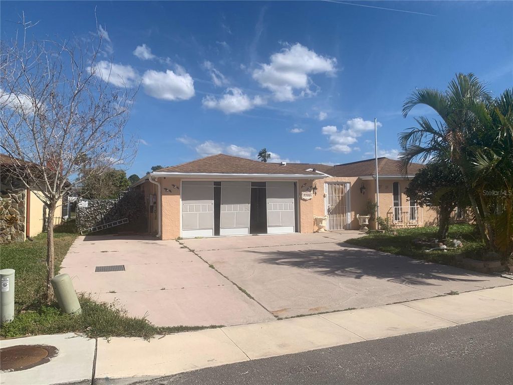 Photo of 9900 Island Harbor Drive, Port Richey, FL 34668 (MLS # TB8379178)