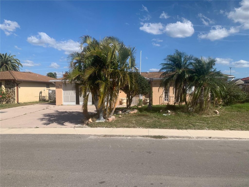 Photo of 9900 Island Harbor Drive, Port Richey, FL 34668 (MLS # TB8379178)