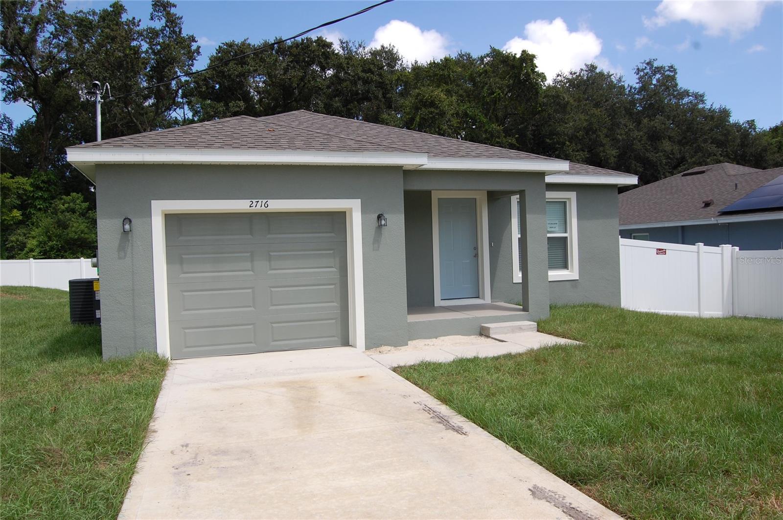 NO HOA! NEW CONSTRUCTION! This brand new block home in Lakeland, FL offers 3 bedrooms, 2 full bathrooms. Open floor plan with laminate in all living areas and carpet in the bedrooms. The openness continues to flow through the kitchen and dining area. Beautiful white shaker cabinets in kitchen and bathrooms. Stainless steel appliances. Indoor laundry closet with washer/dryer hook-ups. An enclosed 1-car garage and fenced back yard finishes off this beautiful new home. The pictures being used are of another home, which is the same model as this listing.
