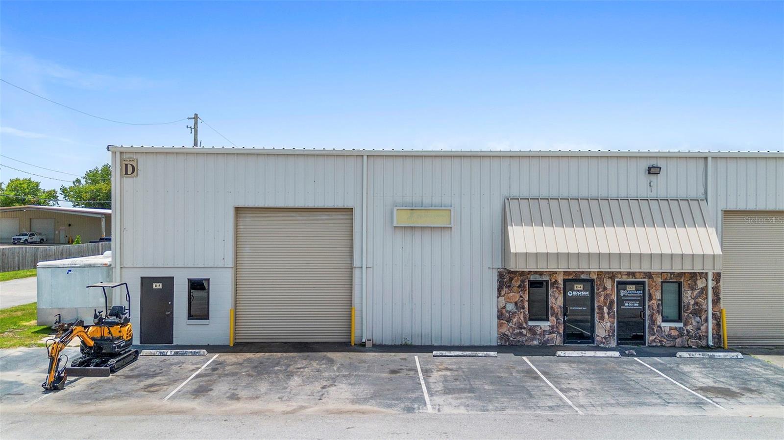 Position your business in this prime end-cap flex unit located in a thriving business corridor, Stonewood Business Park. With dual access points, high visibility and steady traffic flow these units are surrounded by established businesses and services to support daily operations. This property offers a unique combination of showroom, warehouse space, and private offices- perfect for a variety of commercial mixed uses. Both units have a combined total square footage of over 2700sq ft.
which includes additional square footage in unit D5 from an upstairs storage/work area-ideal for operational flexibility. Updated interiors with tile and polished concrete floors, ample lighting and a modern professional feel. Two bathrooms and a break area for added workspaces. Situated along S Nova Rd-a major east-west artery with excellent exposure to approximately 26K vehicles/day with convenient access to I-95, US1, and key Daytona Beach business hubs. Personal property inside not included in sale.
