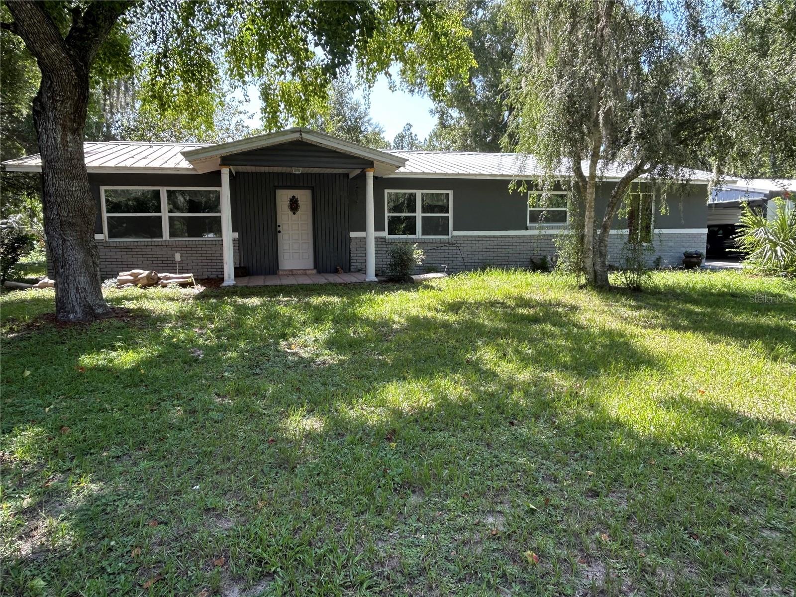 Discover the charm of Crystal River living in this delightful home! Featuring three bedrooms and two baths, its open floor plan is perfect for creating lasting memories. New windows enhance the bright and airy feel, while the spacious, over-half-acre corner lot offers endless possibilities. Updated Kitchen with stainless steel appliances. Conveniently located just 10 minutes from Crystal River and 20 minutes from Dunnellon, you're never far from adventure. All this, with the ease of access provided by paved roads.