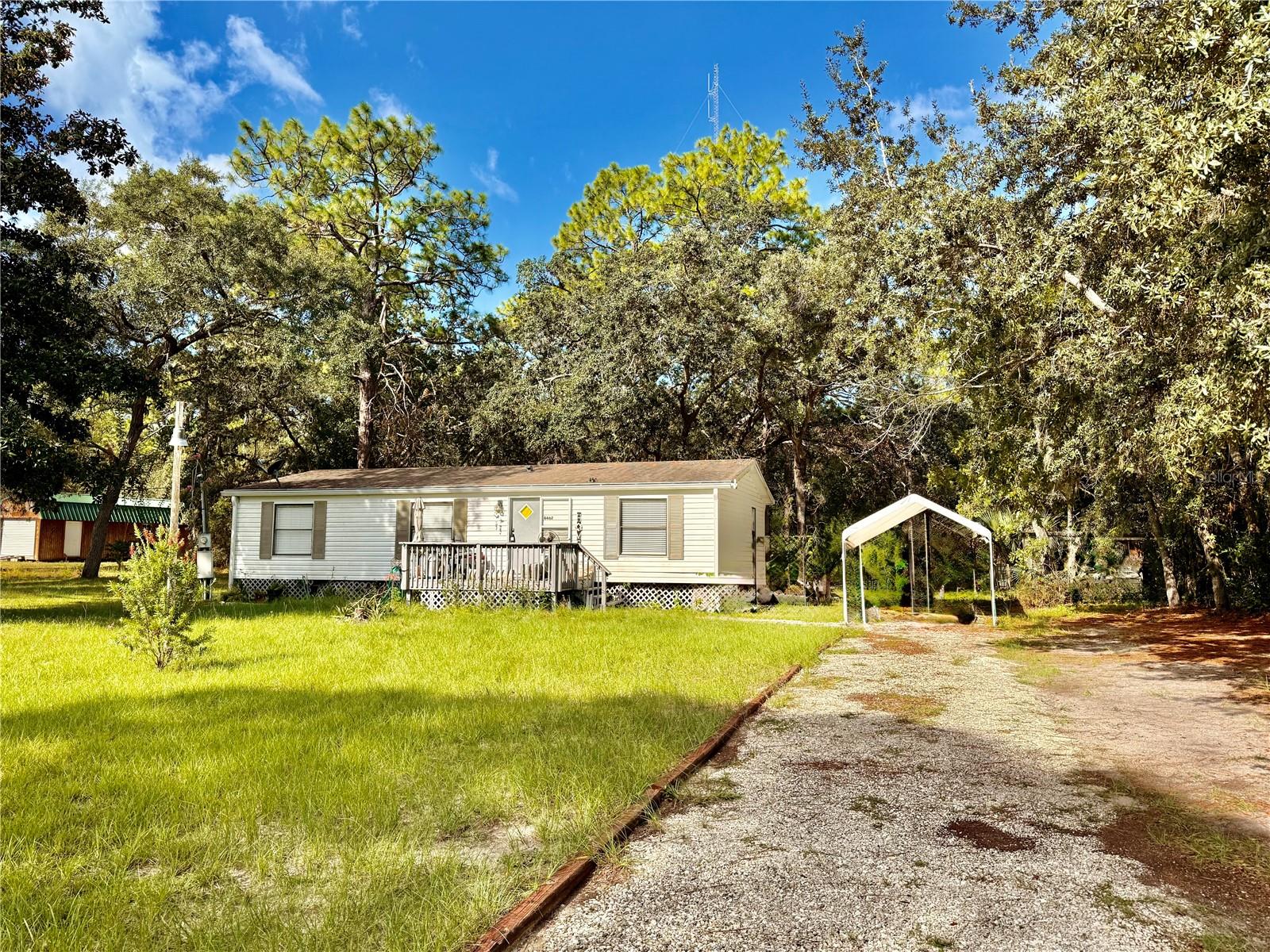 PEACEFUL ACREAGE RETREAT IN HOMOSASSA-NO FLOOD INS NEEDED HERE!
COME SEE THIS 1 ACRE 3/2 MOBILE HOME IN HOMOSASSA FL AND DISCOVER THE PERFECT BLEND OF COMFORT AND PRIVACY. SURROUNDED BY TREES AND BOARDERING CONSERVATION, THIS PROPERTY OFFERS A SERENE NATURAL SETTING WHILE STILL BEING CLOSE TO SHOPPING, DINING, AND THE GULF COAST. STEP INSIDE TO FIND A WELCOMING FLOOR PLAN, FEATURING A KITCHEN ISLAND THATS IDEAL FOR COOKING, ENTERTAINING, OR GATHERING WITH FAMILY. LAMINATE FLOORING RUNS THROUGHOUT THE MAIN LIVING AREAS, MAKING THE HOME BOTH STYLISH AND EASY TO MAINTAIN. THE SPLIT FLOOR PLAN PROVIDES PRIVACY FOR THE PRIMARY SUITE, WHILE THE TWO ADDTIONAL BEDROOMS AND A FULLBATH ARE PERFECT FOR FAMILY OR GUESTS. COME AND ENJOY THE OUTDOORS IN YOUR OWN PRIVATE SPACE WITHH PLENTY OF ROOMFOR A GARDEN, PETS OR EVEN FUTURE EXPANSIONS. WHETHER YOU ARE LOOKING FOR A FULL-TIME RESIDENCE, A SEASONAL GETAWAY, OR AN INVESTMENT PROPERTY THIS HOMOSASSA GEM CHECKS ALL THE BOXES. BRING YOUR BOAT, RV AND ENJOY THIS IDEAL PROPERTY FOR THOSE WHO WANT TO BE HOA AND CDD FREE!!