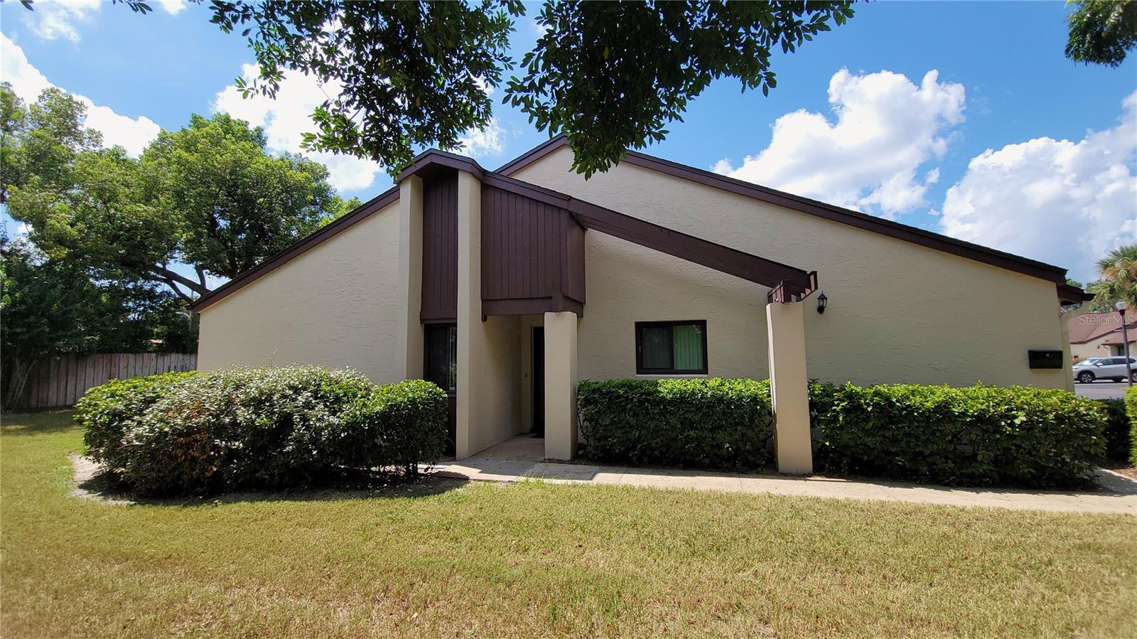 ORANGE CITY: Beautiful 55+ plus condo move in ready. This charming condo features a kitchen with stainless steel appliances and real wood cabinetry. The formal dining area seamlessly flows into the spacious family room, with an additional bonus sunroom perfect for relaxation. The interior features easy-to-maintain flooring throughout—no carpet! Convenient in-unit washer and dryer, plus ample storage space. The sunroom leads to a private rear door that opens to a lush green space, ideal for gardening. Located less than a mile from grocery stores, restaurants, and shopping, this condo offers resort-style amenities including a pool and clubhouse for your enjoyment!