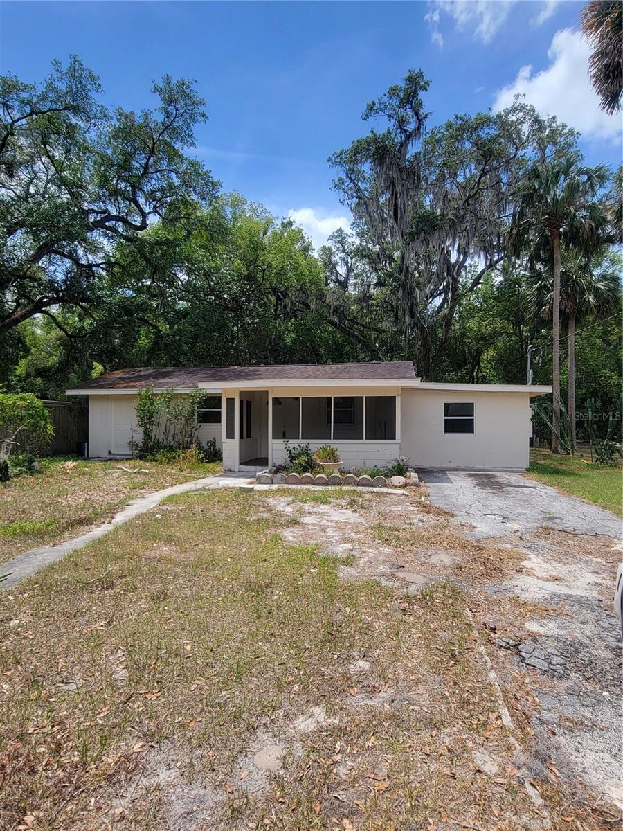 LARGE BACK YARD - Block Ranch style home with a screened in front porch. This home offers 2 bonus rooms and an inside utility room (bonus room offers separate entry). Updated kitchen includes new Range and Refrigerator. Inside utility room and updated bathroom with shower/tub. New laminate flooring throughout. Roof 2015; no HOA, shed.