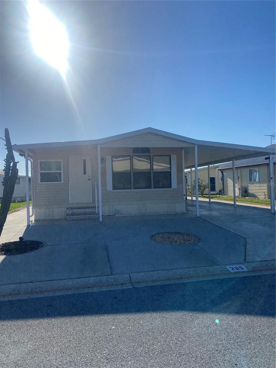 This well-maintained move in ready home will invite you in!  It is located at the back of the park, so it is very quiet. Upgrades include new motor blower in the 2017 CHA, Florida room reframed, drywall, new windows, new siding, 2 downspouts added, 5 tiedowns added to metal roof, new kitchen sink, and some rooms painted. It is convenient to everything you could want: Doctors, shopping, restaurants, parks, hospitals, theatres, and this park is very active! Like golf? Golf courses in every direction! This park is gated and the fees are reasonable for everything you get here. Call for a time to see your year-round or winter home today!