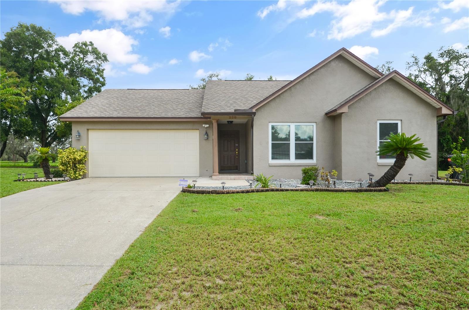 Looking for a home on a quiet cul-de-sac? Welcome to 228 Buckhorn Run in Lakeland. This 3-bedroom, 2-bath home sits on a spacious quarter-acre lot with no rear neighbors, giving you privacy and room to enjoy your backyard however you like.
Step inside and you’ll find a bright, open layout that’s easy to make your own. The living and dining spaces flow comfortably, the kitchen has plenty of storage, and the split-bedroom design gives everyone space to spread out. The primary suite includes its own bath, while two additional bedrooms offer flexibility for family, guests, or even a home office.
The big-ticket items have already been taken care of: AC and water heater are just 5 years old, the roof is 9 years old, all windows were replaced a year ago, and the interior and exterior have been freshly painted. Even the garage door is new, giving you peace of mind and fewer maintenance worries.
Outside, the cul-de-sac location means minimal traffic, and the oversized lot is perfect for weekend gatherings, pets, or just soaking up the Florida sunshine.
Beyond the home, you’re in one of Lakeland’s most desirable and fast-growing areas. With scenic trails, lakes, and parks nearby, outdoor adventures are never far away. Add in Lakeland’s steady growth in both population and median income, and this property doubles as a smart investment and the perfect starter home.