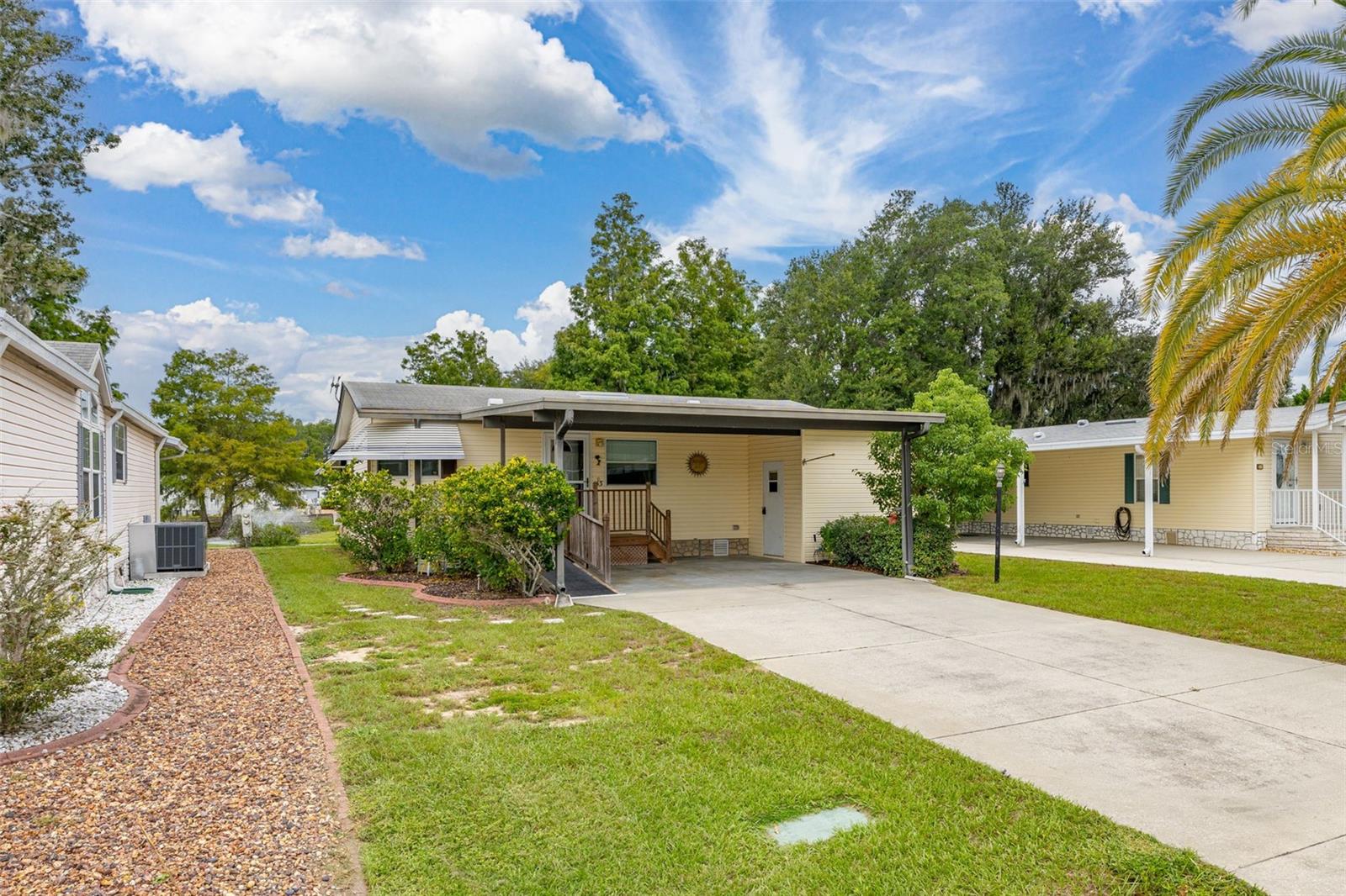 55+ Community Living At It's Best! Enjoy resort-style living in this charming 2 bedroom, 2 bath home with plenty of extra storage. Nestled in a beautifully maintained community, this home offers stunning views of the lake and golf course. Conveniently located near shopping, dining, Disney and endless entertainment options. Residents enjoy an abundance of amenities, including 2 sparkling pools, a welcoming clubhouse, golf course, shuffleboard, and a variety of social activities. Whether you're relaxing at home or taking part in community events, this home has everything you need to enjoy the lifestyle you deserve. Including accessibility for your convenience.
