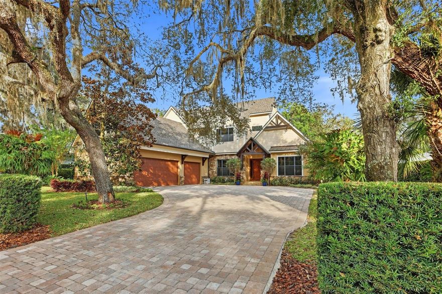 Architecturally refined and thoughtfully designed, this custom built Transitional Craftsman residence blends timeless craftsmanship with modern luxury in the heart of Historic Olde Windermere. Rich wood detailing, exposed pecky cypress beams, and dramatic stonework create warmth and depth throughout. The chef’s kitchen is both functional and sculptural, featuring a stone-framed cooking alcove, premium JennAir® appliances, custom ceiling-height cabinetry, and a walk-in pantry designed for serious cooks and entertainers. The home offers six bedrooms and six bathrooms, with two main-level owner’s suites providing exceptional functionality and privacy. Multiple living spaces are anchored by a striking floor-to-ceiling stone fireplace and beautiful library with rolling ladder, while upstairs bedrooms and bonus room are thoughtfully designed for comfort and quiet, complemented by quality finishes throughout. Recent updates include a newly installed roof (2024), windows (2025), enhancing both peace of mind and long-term value. A spacious three-car garage adds both convenience and functionality.  Outdoors, the home transitions easily to an entertainer’s retreat with covered porches, fireplace, outdoor kitchen, circular firepit, cabana bath, Tiki hut and lush landscaping. Deeded access to the Butler Chain of Lakes and a prime location within Windermere’s vibrant town center with its new re-development complete this rare offering where architectural integrity meets a fun and functional Florida lifestyle.