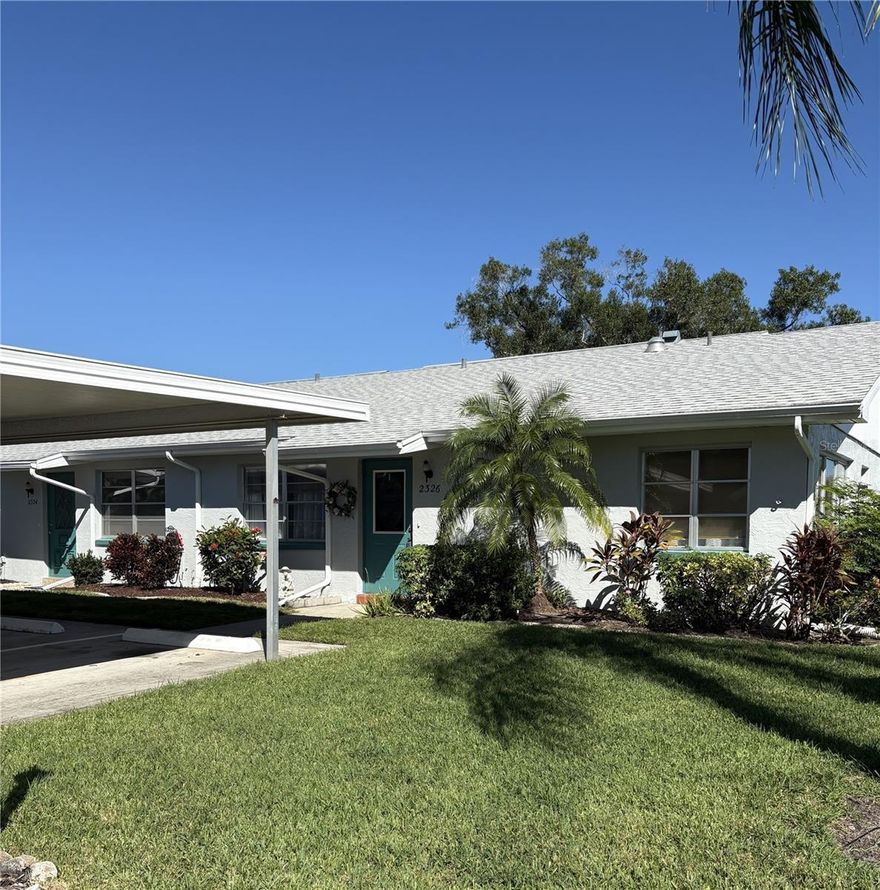 Come join one of the most desirable, active 55+ communities!  This is a  beautiful 2 bedroom, 2 bath condo with an enclosed Florida room, two covered parking spots and a potential golf cart garage. There is an updated kitchen with stainless appliances, white cabinetry and a pass through to the Florida room. A spacious living room and separate dining area that leads to a very nice size Florida room. The master bedroom features a walk-in closet, room for a king size bed and updated en-suite bathroom with shower.  The guest room is large and bright and steps from the second updated bathroom. No carpeting!  Tile, manufactured wood or luxury vinyl flooring in every room. Lawn care, basic cable, internet, amenities fees for two, water and sewer are all included. All you pay are electric and phone. Enjoy the resort lifestyle with the properties many amenities including gated 24-hour security, 2 clubhouses, heated indoor and outdoor pools, multi-million-dollar fitness center. pickleball, tennis, lawn bowling, daily social events, live entertainment, 27 holes of golf, 6 indoor and outdoor pools, tennis courts, and hundreds of unique social clubs, groups, organizations and classes, our community is a great place to really live. Entertainment, education, recreation and friendships are all found within the realm of this community., several restaurants and a bar, arts and crafts, tram service, group travel and too much more to mention. Centrally located Tampa, Sarasota and St. Petersburg and only a short drive to Orlando or the beach! You'll love living here! No smoking.