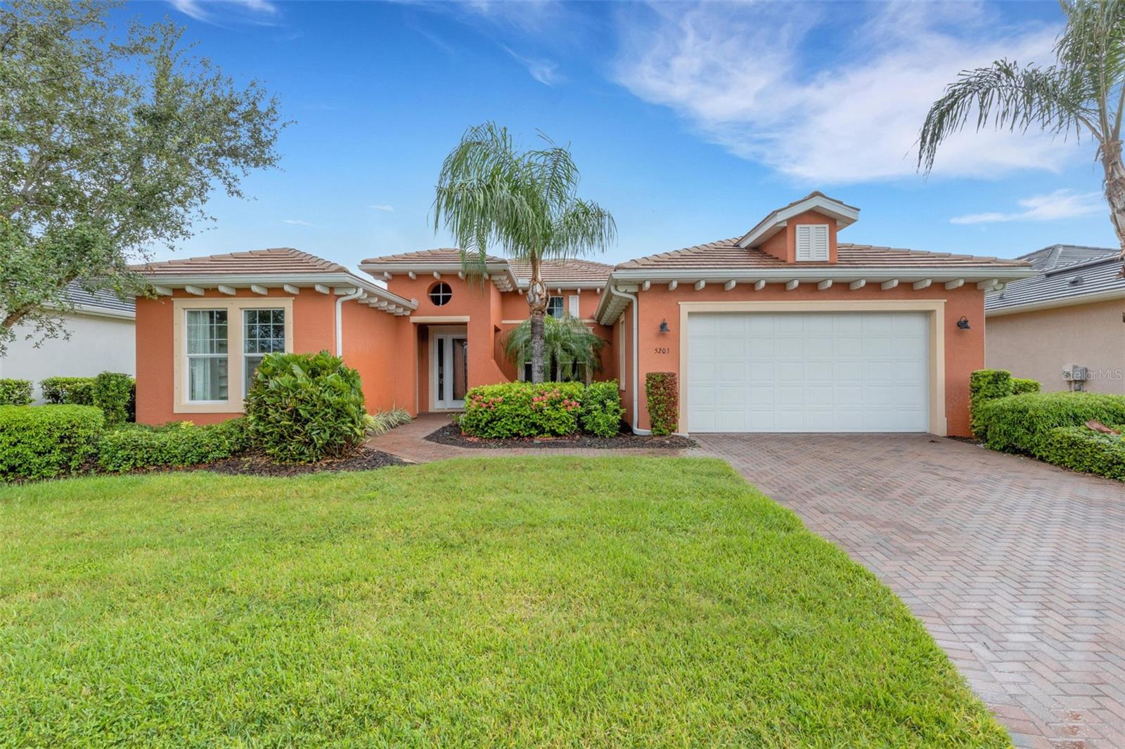 Step into this beautifully upgraded 2,916 sqft. coastal retreat offering 5 bedrooms, 4 full bathrooms, a versatile den, and exceptional design details throughout. This home blends elegance, comfort, and resort-inspired living in one of the Gulf Coast’s most desirable, 24-hour guard-gated, waterfront communities. Inside, the open-concept layout welcomes you with rich tile flooring, a split-bedroom design for maximum privacy, and serene preserve views from the main living spaces. The expansive primary suite is tucked away in its own wing, featuring a double-entry walk-in closet, dual vanities, a soaking tub, and a large walk-in shower—a true spa-like retreat. The fifth bedroom is a casita upgrade which boasts a Murphy bed and custom built-ins, ideal as a guest suite, home office, or creative studio. The separate den adds even more flexibility. The back lanai is an entertainer’s dream, complete with a full outdoor kitchen, above-ground spa, and tranquil nature views. Beyond your door lies the Tidewater Preserve lifestyle: a premier boating community with private marina and Gulf access, over 400 acres of natural beauty, a scenic two-mile riverwalk, resort-style pool, fitness center, playground, lighted tennis courts, and two clubhouses—The Lodge and The Port & Court Club—for recreation, events, and social gatherings. All just minutes from award-winning Gulf beaches, vibrant downtown Sarasota, and the culture of Tampa Bay. Discover a home and a community that truly have it all—luxury, leisure, and the ultimate Florida waterfront lifestyle.