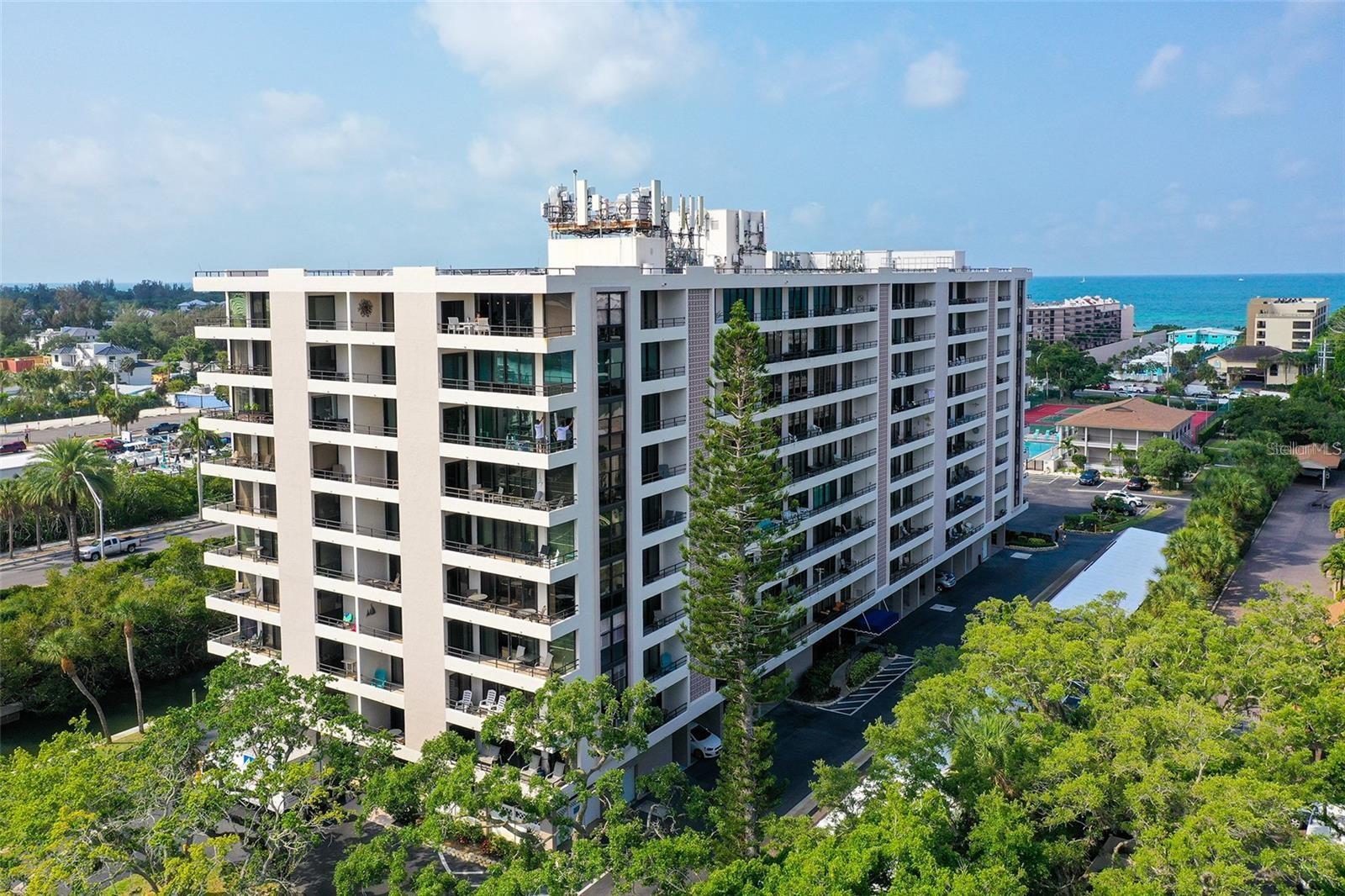 Discover this beautifully renovated and fully furnished 1,287 square foot condominium on Siesta Key, featuring 2 spacious bedrooms and 2 modern bathrooms. Nestled in the prestigious Anchorage Yacht and Tennis Club, this southern-exposure gem offers breathtaking views of both the Gulf and the Intercoastal Waterway. Ideal for both personal use and investment, the HOA permits weekly rentals year-round when not owner-occupied.
Step inside unit 607 to find a bright, open-concept living area that connects to a private, condo-width balcony through sliding glass doors. The fully-equipped kitchen, adorned with elegant granite countertops, opens onto the dining area and living space, perfect for entertaining or enjoying quiet evenings at home.
The expansive master suite features an ensuite bathroom with a luxurious walk-in shower, a separate dressing area, a generous walk-in closet, and its own access to the balcony. The inviting guest bedroom also includes a walk-in closet and balcony access, ensuring comfort for all your visitors.
This unit comes with a deeded carport, along with ample guest parking for your convenience.
The Anchorage offers an impressive array of amenities, including an Olympic-sized heated swimming pool, a state-of-the-art fitness center, lighted pickleball and tennis courts, a clubhouse, BBQ and picnic areas, and kayak storage facilities.
With private beach access to the renowned Siesta Key Crescent Beach, The Anchorage combines the luxury of resort-style living with the comforts of a residential community. Enjoy living or vacationing in this prime location condominium on beautiful Siesta Key. Don’t miss your chance to own this exceptional property!