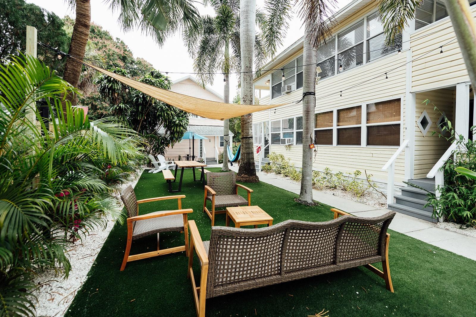 Available for midterm or long-term rental (30+ days) – no short-term rentals. No pets (service animals only). Step into the vibrant Key West vibes of Mallory Square in charming downtown St. Petersburg! This "Little White House" apartment is designed with the iconic key west residence in mind. This downstairs unit is part of a boutique Key West-inspired complex, designed to feel like a private island retreat in the heart of the city. This fully furnished and fully stocked apartment draws inspiration from beautiful Key West Florida, with coastal décor and tropical touches throughout. Perfect for extended stays, it includes a dedicated workspace with natural light, providing a peaceful and productive work-from-home setup. Rent includes all utilities and high-speed internet, with AC via mini-split and window units. Enjoy professional laundry service provided at move-in and move-out, plus onsite shared laundry accessible via app (additional charges) during your stay. Additional cleanings available upon request for a fee. Location Highlights: Nestled in a walkable, colorful neighborhood just minutes from downtown St. Pete, you’re steps from local coffee shops, unique restaurants, and boutique shopping. Explore nearby Central Avenue, Vinoy Park, museums, and take a short drive to St. Pete Beach. Relax in the laid-back charm of Mallory Square’s tropical courtyard with lush landscaping and turf. Move-in Requirements: First month’s rent, cleaning fee, and security deposit. Availability:7 units total – 1BR/1BA and 2BR/1BA layouts available. Contact agent for availability and pricing.
