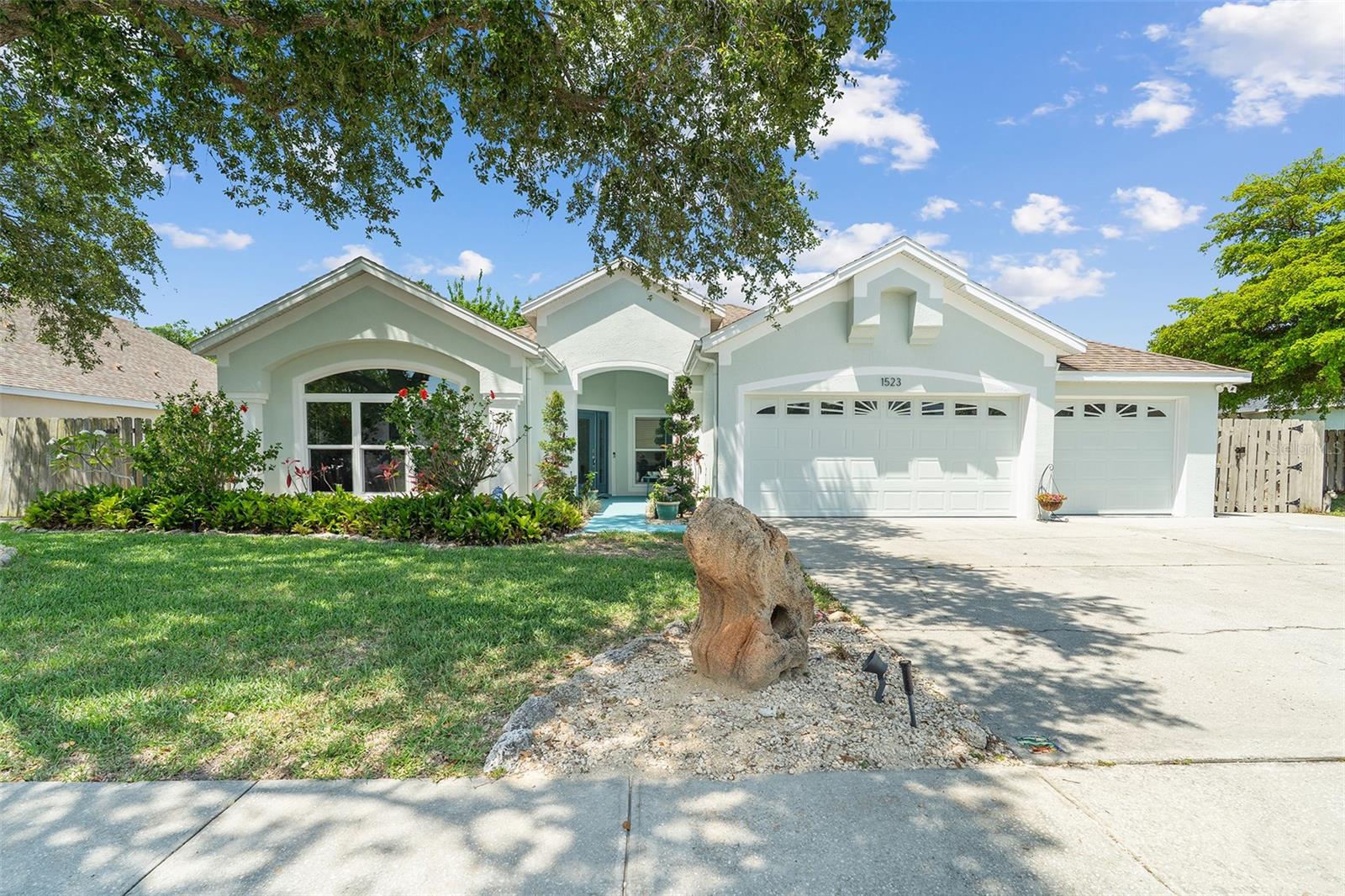 PRICE IMPROVEMENT! Bring your boat and settle right into this well-maintained home in the popular Island Crossings community in Merritt Island! Perfectly located just minutes from Kelly Park boat ramp, this spacious floor plan includes a 3-car garage and designated boat parking. Sellers spared no expense and offers peace of mind with BRAND NEW hurricane-impact windows/doors, and Storm Buster hurricane panels (2025). Additional improvements include EXTERIOR durable elastomeric paint (2024), A/C (2020), Roof (2018), WATER HEATER (2018), Trex decking, Lush landscaping with energy-efficient LED lighting and eye-catching color-changing spotlights adds charm and visibility. Enter through a gorgeous leaded glass door to an open concept design with high ceilings and plenty of natural light. The formal living room is versatile and is currently utilized as a music room. A formal dining room offers an ideal setting for special meals, while the kitchen showcases granite countertops, a custom tile backsplash, under-cabinet lighting, and newer stainless steel appliances—including a Bosch refrigerator (2022), Frigidaire air fry oven and microwave (2021). For everyday dining, enjoy the separate dinette area or the convenient breakfast bar that overlooks the expansive family room. Designed for privacy and versatility, the 3-way split floor plan includes a bedroom with double doors, perfectly suited as a home office, study, or flex space. The sizeable primary bedroom offers a large walk-in closet, upgraded remote ceiling fan/light, and sliding doors to your lanai. The ensuite bathroom includes split dual sink vanity with granite top, tiled shower, and garden tub for relaxation. Secondary bedrooms are roomy with two sharing a Jack-n-Jill bathroom. A fourth bedroom is located on the opposite side of the home, along with a bathroom that leads to the lanai. For outdoor living, a fully fenced backyard backs to a conservation/greenbelt and can be enjoyed year-round from the expansive screened-in lanai, complete with a fireplace and built-in pizza oven. Additional features include: Luxury vinyl flooring in the formal living room and office/bedroom, contemporary lighting and ceiling fans throughout, a well-appointed interior laundry room with sink, and ample storage space in the 3-car garage add to the home's functionality. Island Crossings is conveniently located to the Beachline Expressway, Port Canaveral, Kennedy Space Center, shopping, dining, and just minutes to the beach. Don't wait for a chance to experience the best of island living! Call today to schedule a private showing.