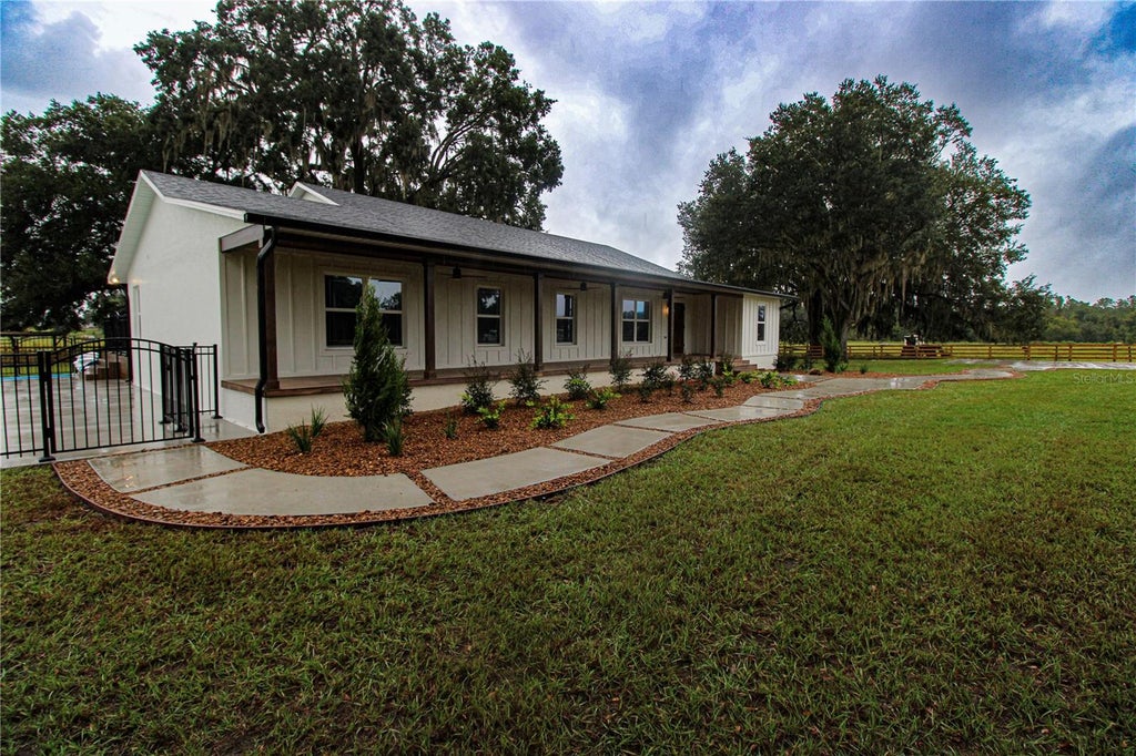 Photo of 3276 County Road 216, Oxford, FL 34484 (MLS # GC543875)