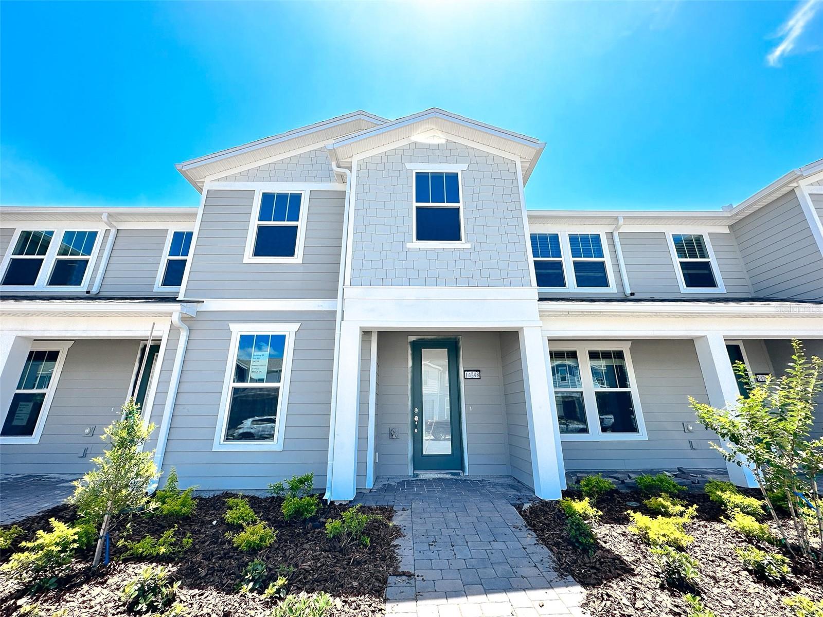 Like new and move-in ready! Built in 2023, this beautifully maintained two-story townhome offers 4 bedrooms, 3 full bathrooms, a fenced-in courtyard, and a spacious 2-car garage. The first floor features upgraded tile flooring, an open-concept kitchen with an oversized island, a generous living and dining area, and a guest bedroom with a full bath. Upstairs, you’ll find the primary suite, two additional bedrooms, another full bath, and a laundry room with washer and dryer included. Located in the gated community of Isles at Lake Nona, residents enjoy access to top-tier amenities including a clubhouse, fitness center, resort-style pool, playgrounds, basketball and tennis courts, and more. Rent includes internet and lawn care for added convenience. Ideally situated near Lake Nona Town Center, Medical City, and the USTA, with easy access to SR-417 for a smooth commute. Zoned for highly rated schools!