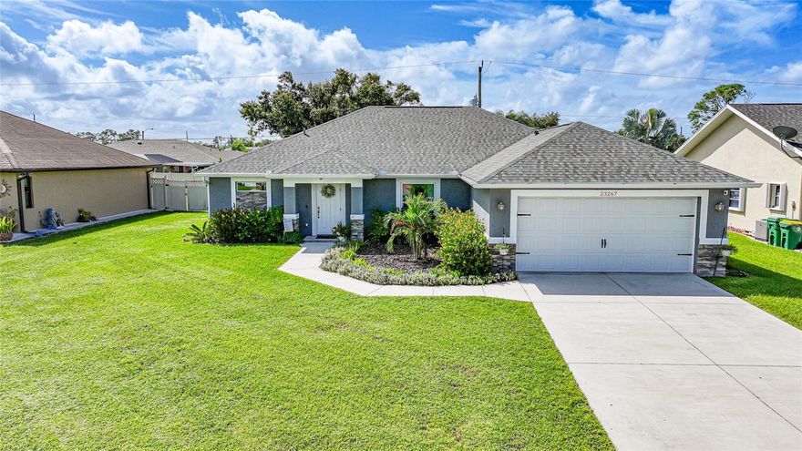 Section 15 beauty! This stunning 4 bedroom home is located in one of Charlotte County’s most desirable areas. Public water and sewer, not in a flood zone. From the moment you arrive, you’ll be impressed by the curb appeal featuring mature landscaping and elegant stacked brick accents. Step inside to a welcoming foyer with a tray ceiling that opens to a bright and spacious layout. The home offers tile flooring throughout, multiple tray ceilings, and upgraded lighting that adds a touch of sophistication to every room. The gourmet kitchen is a true centerpiece, boasting a large island, quartz countertops, stainless steel appliances, and a dining area just off the kitchen—perfect for entertaining or family meals. The oversized primary suite features dual closets and a private en suite bathroom with a beautifully tiled walk-in shower. Guest bedrooms are equally spacious and inviting, sharing a well-appointed second bathroom. Convenience continues with a roomy laundry area located off the kitchen, complete with a mop sink. Home has been meticulously maintained and updated including a 2023 roof. Step out to the lanai with a paver floor overlooking the private backyard lined with a lush privacy hedge—ideal for relaxing or hosting outdoor gatherings. This exceptional home is close to shopping, dining, medical facilities, and more, offering both comfort and convenience in a prime location.
