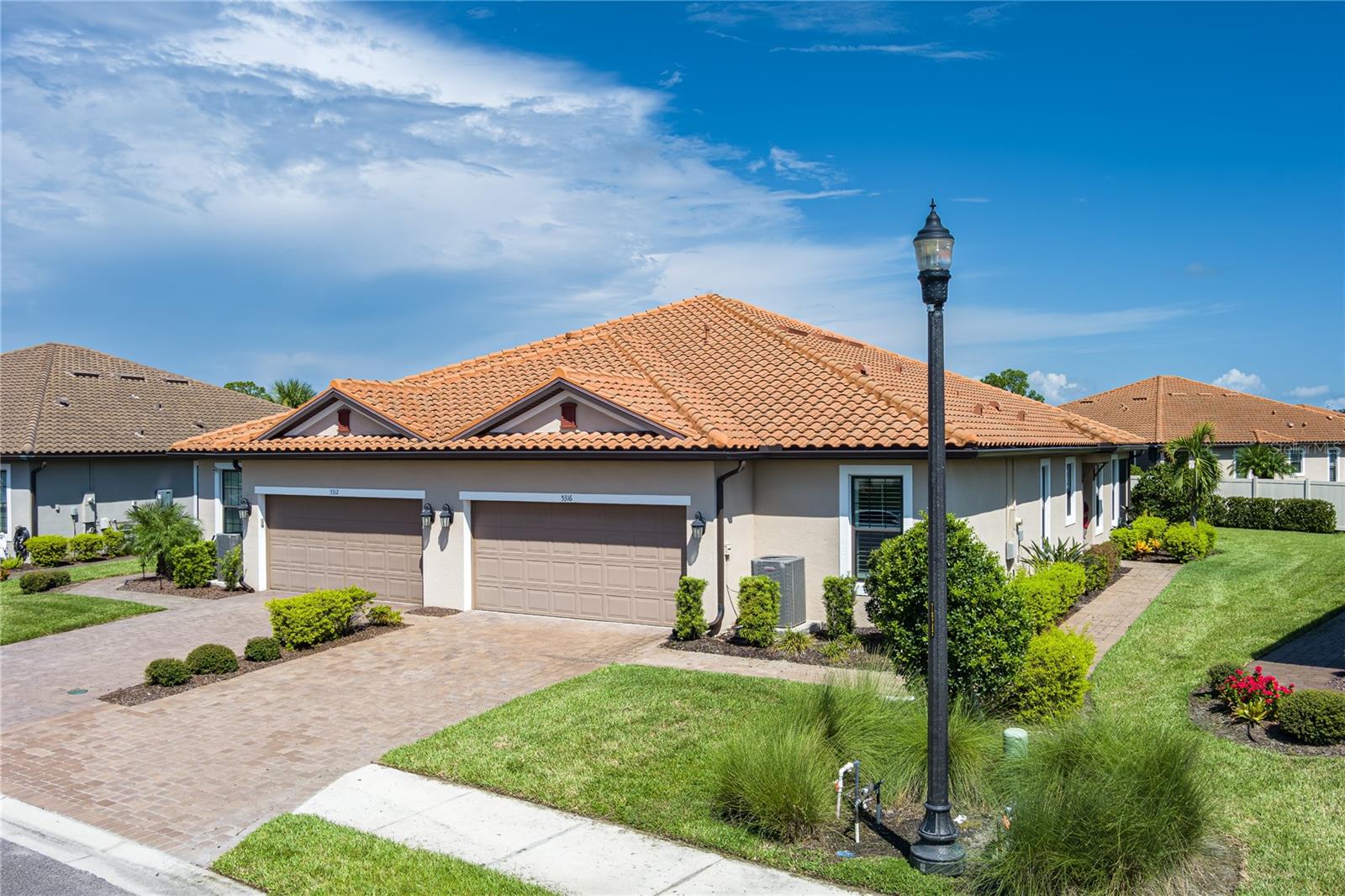 If you are looking for the ultimate RESORT LIFESTYLE, this community is for you! Esplanade at Artisan Lakes is situated on 800 pristine acres dotted with lakes, preserves and mature trees. There is a full-time Activities Director and numerous themed Parties throughout the year and many Special Interest Clubs to fill your days and night. Here you will enjoy Pickle Ball, Tennis, Bocce Ball, Playground, Basketball, Dog Parks, Luxury Lap Pool, Resistance Pool, and Lagoon Style Pool with services like you would expect at a high end hotel .Other amenities include a State of the Art Fitness Center, Full Spa, Billiards Room, Cooking Kitchen, Cardroom/Library and Dance/Yoga/Pilates Room. This gorgeous "move in ready" villa has 10' ceilings and 8' doors, making it appear much larger. Both bedrooms have en-suites and are on opposite sides of the home. The numerous features of the OPEN FLOOR PLAN include a HUGE Great Room, Spacious Dining Room, Versatile Flex Room, conveniently located Half Bath and Laundry Room, Breakfast Bar, 42" Designer Kitchen Cabinets, Tray Ceiling Package, Gas Stove and Water Heater, Plantation Shutters, Quartz Countertops, Ceiling Fans, 18"x18" tile except in bedrooms which are carpeted, Screened Lanai, Rain Gutters, and Tile Roof to name a few. Artisan Lakes is centrally located near I-75 and Rte 41 with easy access to Tampa, St Pete, Sarasota, and Bradenton. WORLD CLASS Beaches, Shopping, Golf Courses, Airports, and Medical Facilities are just minutes away. Come claim your "Piece of Paradise"...YOU DESERVE IT!!! **FURNITURE IS NEGOTIABLE**