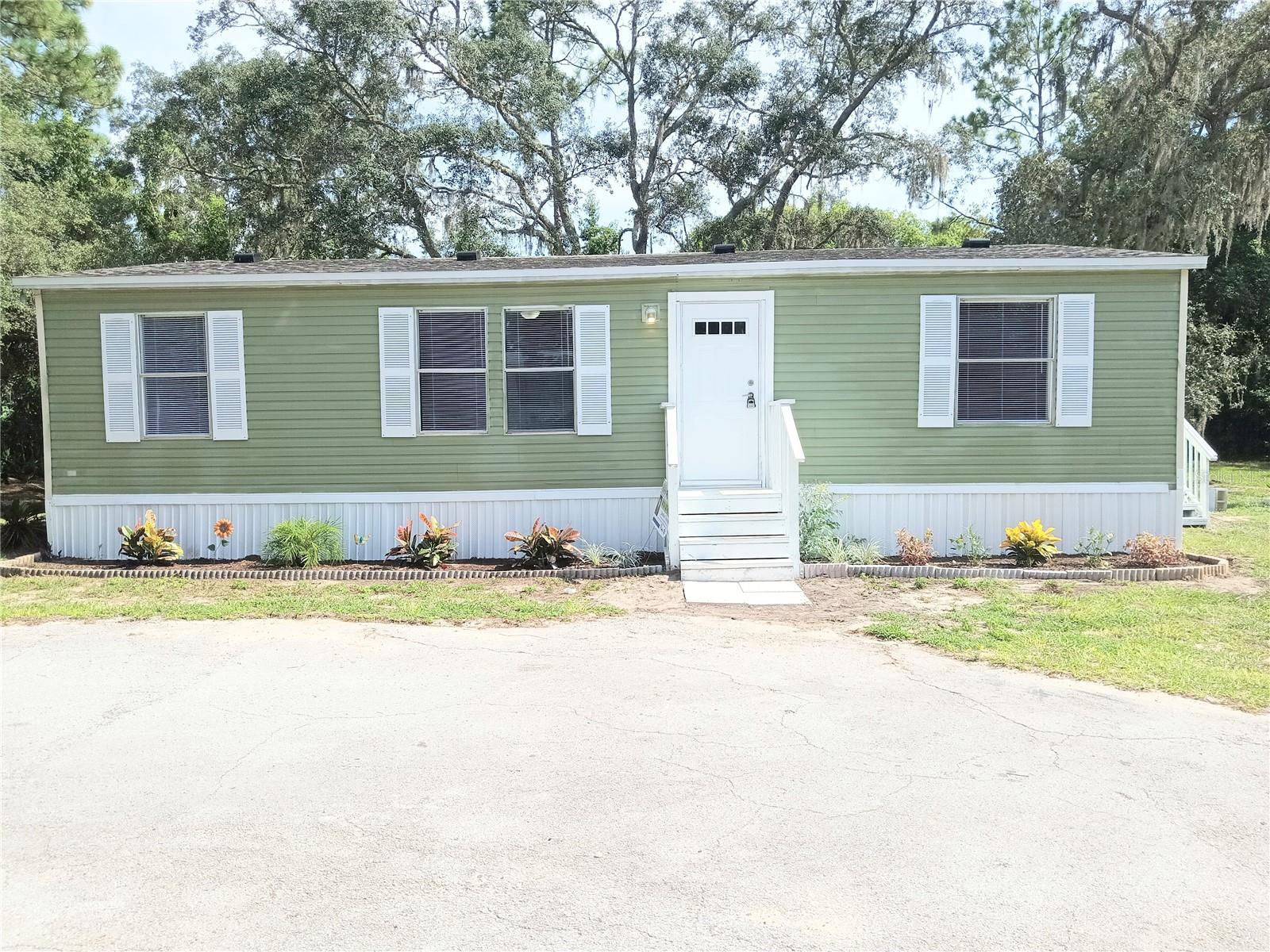 Honey stop the car!!! Featuring 3 bedrooms and 2 full bathrooms, this beautiful and completely updated manufactured home has it all and sits on a boastful 0.51 acre lot. The inside features an open floor plan with a Living Room/Kitchen combo and is complete with a fresh coat of paint, updated sub-flooring throughout, updated drywall throughout, new cabinets, new counter tops and new vanities in both bathrooms, new ceiling fans installed in all rooms, recessed lighting throughout, Luxury Vinyl flooring and more. The outside features and fresh coat of paint, New AC unit, New Roof, and updated landscaping. Call today to schedule your showing!