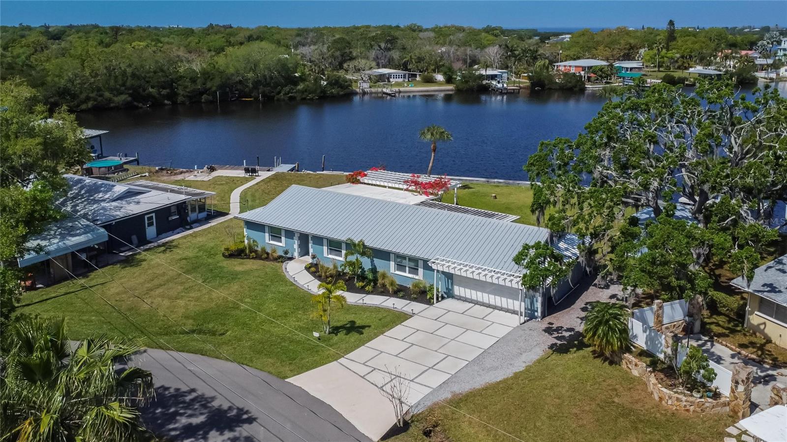 Welcome to waterfront living at its finest! This stunning property at 2623 Manatee Harbor Dr. offers breathtaking views and luxurious amenities in the heart of Ruskin, FL. Nestled along the serene shores of the Manatee River, this meticulously maintained home features 3 bedrooms, 3 bathrooms, and 2244 square feet of living space. Step inside to discover an open floor plan flooded with natural light, highlighting the elegant finishes and attention to detail throughout. The spacious kitchen boasts modern appliances, stone countertops, and ample storage, perfect for entertaining guests or preparing family meals. Unwind in the expansive primary suite, with a wall of closet space, perfect if you have lots of clothes and shoes! Additional bedrooms offer flexibility for guests, home offices, or hobbies and each bedroom has an attached private bathroom! The outdoor living space is a true oasis, featuring a covered and screened lanai and lush landscaping—all with panoramic views of the river. Enjoy boating, fishing, or simply relaxing in the Florida sunshine from your own backyard. Located in the desirable community of Manatee Harbor, residents enjoy access to exclusive amenities, including a private dock and boat ramp. Plus, with easy access to nearby shopping, dining, and entertainment options, you’ll experience the best of waterfront living with convenience at your fingertips. Don’t miss this opportunity to own your own piece of paradise! Schedule your showing today and experience luxury waterfront living at 2623 Manatee Harbor Dr., Ruskin, FL. Please contact with any additional questions.