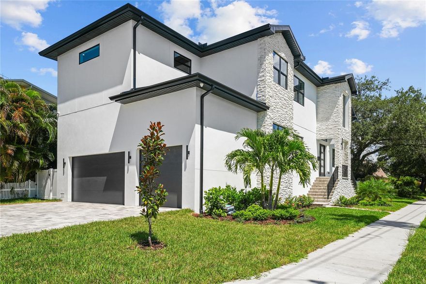 MOVE-IN READY!! Your search for new construction in the best location in South Tampa is over! 312 W Davis is an amazing opportunity to own a brand-new home with a custom feel. Beyond the five bedrooms, study, bonus room, four and a half baths, saltwater pool and spa, formal dining room and outdoor kitchen this beauty offers many unique features that set it apart from the rest. As you approach the home note the decorative, cultured, Boral stone and custom pavers. Upon entry, look up to enjoy 23 feet ceilings and ahead to a spectacular fireplace with floor to ceiling Venetian plaster detail. There is also a private study to the right with coffered ceilings. The kitchen is perfect for the inspired home chef! With JennAir RISE appliances, gas cooktop, and pot filler, no meal will be mundane! The island offers plenty of storage thanks to nine drawers versus typical cabinets. The quartz waterfall element is made even more exceptional with a 2-inch edge. The finishes are tastefully done including the marble backsplash and white, solid-wood cabinetry. Open a few of the drawers and cabinets to see more special touches; including an oversized, spice, pull-out cabinet; special, hidden, cooking utensil containers; and multi-level silverware dividers. Beyond the kitchen to the right, is a mudroom with multiple cubbies and a broom closet off the garage. The THREE CAR GARAGE features epoxy flooring, extra storage space and side motorized doors (allowing for the possibility to add a car lift). Or step to the left of the kitchen and find a large walk-in pantry with custom shelving. There is also a wet bar with beverage fridge and an ice maker. The dining room is artfully tucked away and has a feature wall and wine display for your favorites. Want to entertain outside? Open your French doors off the family room to the pavered lanai and outdoor kitchen with oversized grill, beverage fridge and sink. Or enjoy a dip in your saltwater pool and spa! The lush hibiscus bushes and large pavers framed in turf will make you feel like you are at a resort! Back inside, guests will appreciate the private bedroom and full bath. Venture up the wide staircase to find the primary suite. Don’t be fooled by the first closet you see, beside the spacious bathroom, discover a custom closet larger than most bedrooms! The bathroom is stunning. With expansive, separate vanities featuring 2-inch quartz counters and LED lighting underneath.  Take a moment to imagine a luxurious bath in your free-standing tub. Also upstairs, find a large laundry room, three bedrooms, a bonus room and two more secondary baths. All the bedrooms feature walk in closets with custom shelving systems and additional LED lighting. Other exceptional details include wide plank French oak flooring throughout, custom tile in the baths, three AC systems, 2 tankless hot water heaters, impact rated windows and doors, solid interior doors and so much more! Check out the features list in the attachments for a full list! This beauty is zoned for Gorrie, Wilson, and Plant and convenient to downtown, Tampa International Airport and so much more! Schedule your showing today!