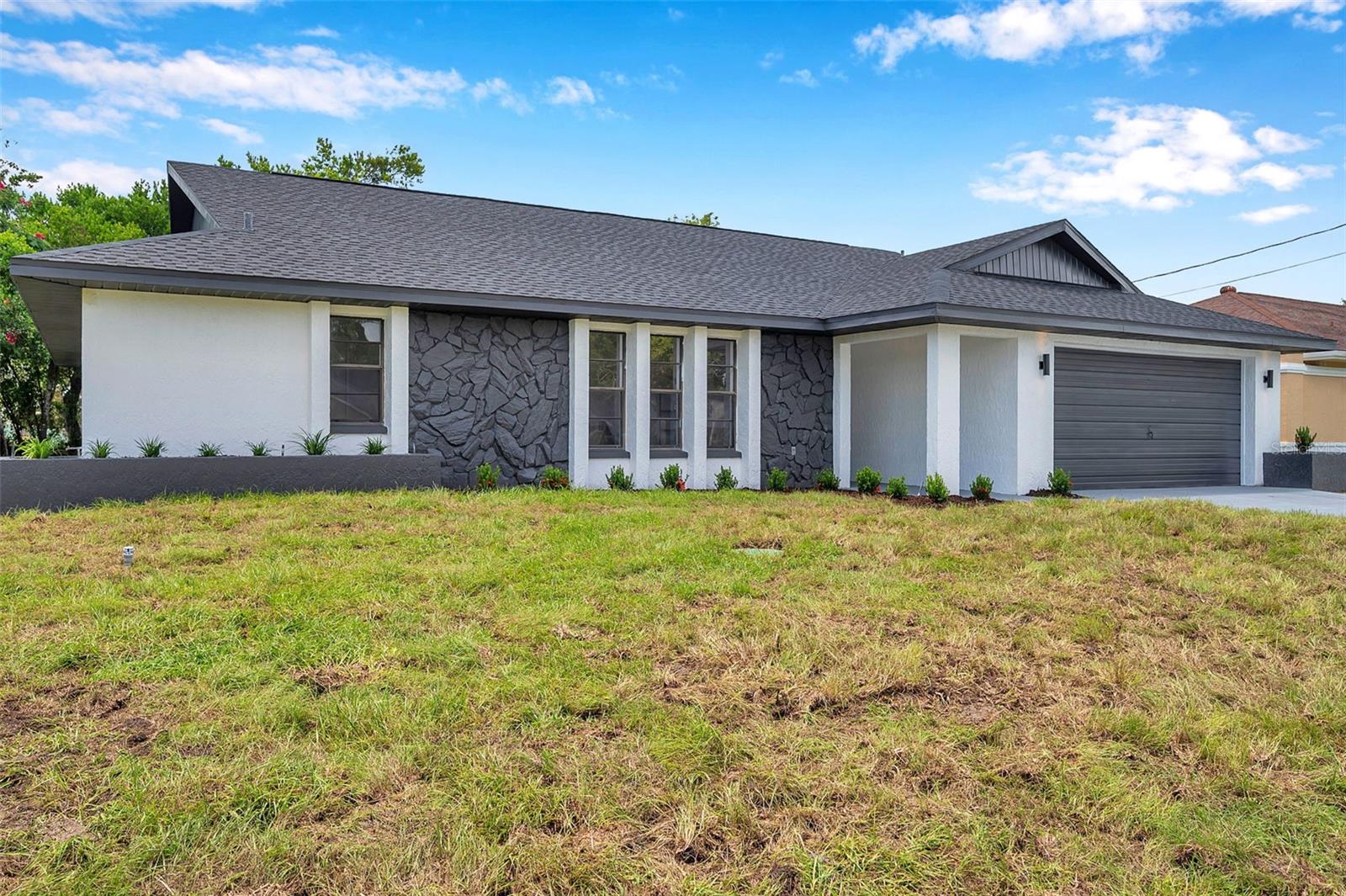 Fully Renovated 3/2/2 Pool Home in Quiet Spring Hill Neighborhood – No HOA or Flood Zone
This move-in ready 3-bedroom, 2-bathroom, 2-car garage pool home has been completely renovated from top to bottom, offering peace of mind and modern comfort in a tranquil Spring Hill setting. Major upgrades include a brand-new roof, new A/C system, and new septic drain field. Located on a quiet street with no HOA, no CDD, and no flood zone.
Step inside to a spacious, open layout featuring a formal living room, family room, dining room, and dinette—ideal for both everyday living and entertaining. You'll love the luxury vinyl plank flooring throughout, with porcelain tile in both bathrooms. The heart of the home is the beautifully redesigned kitchen, showcasing white shaker cabinets with plywood construction, soft-close doors, dovetail drawers, quartz countertops, a modern glass herringbone backsplash, and sleek black fixtures and accents. The dinette area overlooks the pool and brings in plenty of natural light.
The primary bedroom offers generous space, a large walk-in closet, and a fully updated en-suite bathroom with stylish finishes and a walk-in shower.
The split floor plan provides privacy, with the primary suite on one side of the home and two spacious guest bedrooms and a fully updated bathroom on the other. One of the guest bedrooms features direct access to the pool area, making it perfect for an office, guest room, or in-law suite.
Step outside to your private, screened-in pool area, perfect for enjoying Florida living year-round. The wooded backyard adds extra privacy and a peaceful backdrop to your outdoor space.
This beautifully updated home combines high-end finishes, a functional layout, and a serene setting. Schedule your private tour today!