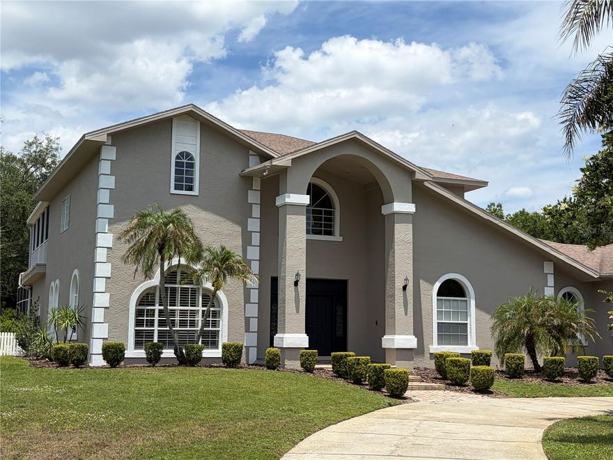 Do not miss this very rear opportunity! Situated on a quiet cul-de-sac, this stunning updated luxury estate sits on nearly one acre and offers a rare combination of lots of privacy, space, and comfort in one of Tampa Bay's most desirable upscale neighborhoods. Surrounded by a wooded buffer on one side and privacy fences from the neighbors on the other side and the rear, this property provides a peaceful, private setting that is incredibly hard to find. With no through traffic and a spacious homesite, this home delivers a true sense of seclusion while remaining conveniently located near shopping, dining, and top-rated schools. Inside, this home offers over 4,100 square feet of thoughtfully designed living space, including 5 bedrooms with walk-in closets and 5 full bathrooms. The layout includes multiple living and entertaining areas, creating flexibility for both everyday living and hosting. The outdoor living space is equally impressive, featuring a screened-in oversized pool and spa, an oversized lanai, and expansive yard space with room to relax and entertain. Additional highlights include a 3-car garage and a functional layout designed to accommodate a variety of lifestyles. Opportunities like this - offering nearly one acre estate in one of the most desired upscale luxury neighborhoods of Tampa Bay in a top-rated school district, tons of privacy, and an updated home within a cul-de-sac setting - are extremely rare in this area. Do not miss owning this rare gem!