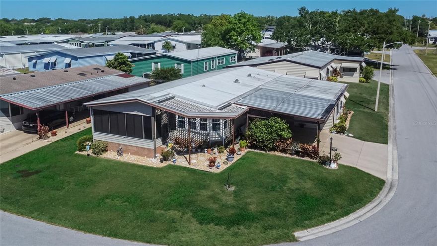 Looking for a 20x24' air-conditioned WORKSHOP? Then Welcome to your snow-free paradise at Foxwood Lake Estates – a highly sought-after 55+ gated community where you truly own the land (NO LOT RENT!). Step inside and be greeted by an inviting open floor plan that seamlessly blends the living, dining, and kitchen areas – perfect for both entertaining and everyday living. Bright and airy, the interior features elegant touches throughout including double pane windows that enhance energy efficiency and comfort. The well-equipped kitchen boasts all cabinetry with pull-out shelves and a convenient pantry, making organization a breeze. Additional highlights include a dedicated inside laundry room complete with sink, spacious walk-in closets, and an instant water heater. Outside, soak in the Florida sunshine on your large enclosed lanai – an ideal space for relaxing or hosting gatherings. For the hobbyist or anyone in need of extra space, the property also offers a huge 20x24 air-conditioned WORKSHOP, providing ample storage and workspace for your projects. This home is sold furnished, ensuring a smooth transition into your new lifestyle. With updated tie-downs, a vapor barrier, and a host of modern features, this residence is ready for you to move in and start enjoying the good life. Foxwood Lake Estates has very low HOA dues with community features that include: Large Clubhouse – Heated Pool – Daily Pickleball play - Outdoor Covered Spa – Indoor Sauna – Health Fitness Center – 12 Lighted Covered Shuffle Courts – 2 Billiard Tables – Bowling League – Golf League – Horseshoes – Bingo – Cards – Crafts – Library – Monthly Newspaper – Harmoneers – Lake Stocked With Fish – Lake Walking Path – Painting Class – Floor Exercises – Variety Shows – Travel Coordinator – Pot Luck Dinners – Pancake Breakfasts – Dances – Computer Club – Bible Study Classes – Line Dancing – Walking or Golf Cart Riding Distance To Sam’s Club – Flea Market and Garage sales twice a year. Perfectly located in Lakeland Florida halfway between Tampa and Orlando, this home offers easy access to Interstate 4 and is a short drive to popular attractions such as Disney, Universal Studios, Busch Gardens, Lowry Park Zoo, Hard Rock Casino and beautiful beaches! Tampa and Orlando airports are also within a 1 hour drive, making travel a breeze. Don’t miss your chance to experience the ultimate in comfort and convenience at Foxwood Lake Estates - schedule your showing today!