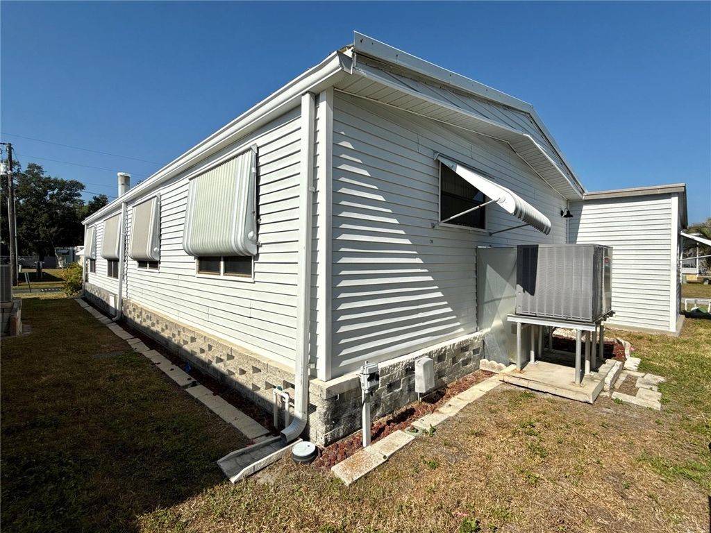 Photo of 6821 Americana Drive NE #106, St Petersburg, FL 33702 (MLS # TB8449805)