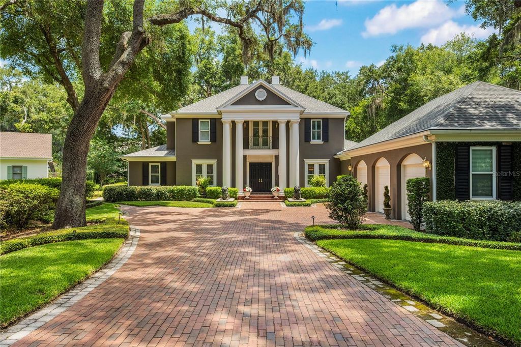 Photo of 5009 Pleasure Island Road, Belle Isle, FL 32809 (MLS # O6408105)