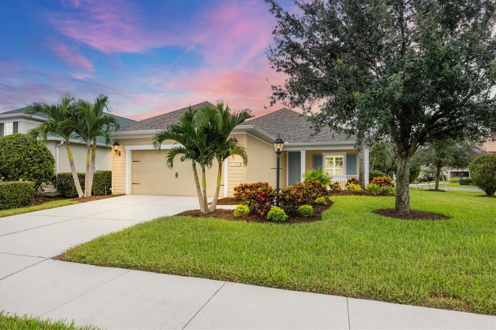 NO CDD FEE! Welcome to luxury living in the heart of Lakewood Ranch, Florida! This magnificent ''White Sands II'' floorplan located in the maintenance free, gated neighborhood of ''Eagle Trace'' has a BRAND NEW roof with energy efficient radiant barrier insulation, FIVE FOOT garage extension and much more! Rest assured your new home is built strong and safe with its whole home alarm system, HURRICANE shutters for each energy efficient window, insulated HURRICANE IMPACT garage door, cinder block construction AND is located in the desirable ''X'' floodzone! This home comes equipped with a 15Kw ''Generac'' natural gas generator which connects to the natural gas line extension outside the home and is capable of powering the appliances in the event the power goes out. Throughout the home you will find premium wooden plantation shutters for all windows, 5 1/4" deco baseboards, LED recessed lighting, premium diagonally laid ceramic tile (NO CARPET) and much more! The kitchen boasts a large Island with breakfast bar, custom cushion close cabinetry with pull outs for easy storage, 5-burner natural gas stove, stainless steel appliances, and under cabinet LED lighting that compliments the custom tile backsplash AND high level granite countertops. The great room with its expansive tray ceiling showcases a spacious environment with more than enough room to entertain guests. The two additional bedrooms provide ideal size and privacy for visitors to stay which both are steps away from the full bathroom. Taking care of the laundry is super convenient for there is a large laundry room at the far wing of the home that consists of a front loader washer, gas dryer, overhead storage, wash tub AND storage closet. The OVERSIZED garage has epoxy flooring, tall ceilings, numerous storage racks and an Insulated HURRICANE IMPACT garage door! Located in a gated community, this residence provides a secure and tranquil environment for residents. This amenity rich neighborhood has a community pool, two dog parks, pickleball/tennis courts, playground as well as having sidewalks on both sides of the street. With it being a maintenance assist neighborhood, you can relax and enjoy the Florida sunshine in style, whether spending time by the pool or engaging in community events. Lakewood Ranch, known for its picturesque surroundings and vibrant community, offers an array of amenities, including shopping, dining, and cultural attractions. Experience the epitome of Florida living in this meticulously designed and thoughtfully appointed ''Neal'' built home.