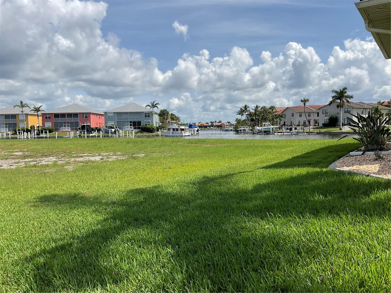 Prime Waterfront Lot with Expansive Canal View.. Discover an exceptional opportunity to own an oversized 11,124-square-foot waterfront lot with a direct view down a wide basin open canal in the highly sought-after community of Punta Gorda Isles! This premium homesite features a 90-foot concrete seawall and offers direct sailboat access to scenic intracoastal waterways—just minutes to open water and Charlotte Harbor. Set in a vibrant and picturesque neighborhood, residents enjoy a wealth of amenities including boating, sailing, golfing, fishing, shopping, beaches, pickleball, tennis, and numerous active social clubs. Golf enthusiasts will love being just around the corner from St. Andrews South Golf Club. Ideally located between Sarasota and Naples, with quick access to I-75 and US-41, Punta Gorda is a historic waterfront city known for its charm, connectivity, and active lifestyle. This is your chance to build the custom coastal dream home you've always imagined in one of Florida’s premier boating communities!
