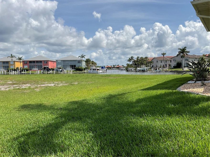 Prime Waterfront Lot with Expansive Canal View.. Discover an exceptional opportunity to own an oversized 11,124-square-foot waterfront lot with a direct view down a wide basin open canal in the highly sought-after community of Punta Gorda Isles! This premium homesite features a 90-foot concrete seawall and offers direct sailboat access to scenic intracoastal waterways—just minutes to open water and Charlotte Harbor. Set in a vibrant and picturesque neighborhood, residents enjoy a wealth of amenities including boating, sailing, golfing, fishing, shopping, beaches, pickleball, tennis, and numerous active social clubs. Golf enthusiasts will love being just around the corner from St. Andrews South Golf Club. Ideally located between Sarasota and Naples, with quick access to I-75 and US-41, Punta Gorda is a historic waterfront city known for its charm, connectivity, and active lifestyle. This is your chance to build the custom coastal dream home you've always imagined in one of Florida’s premier boating communities!