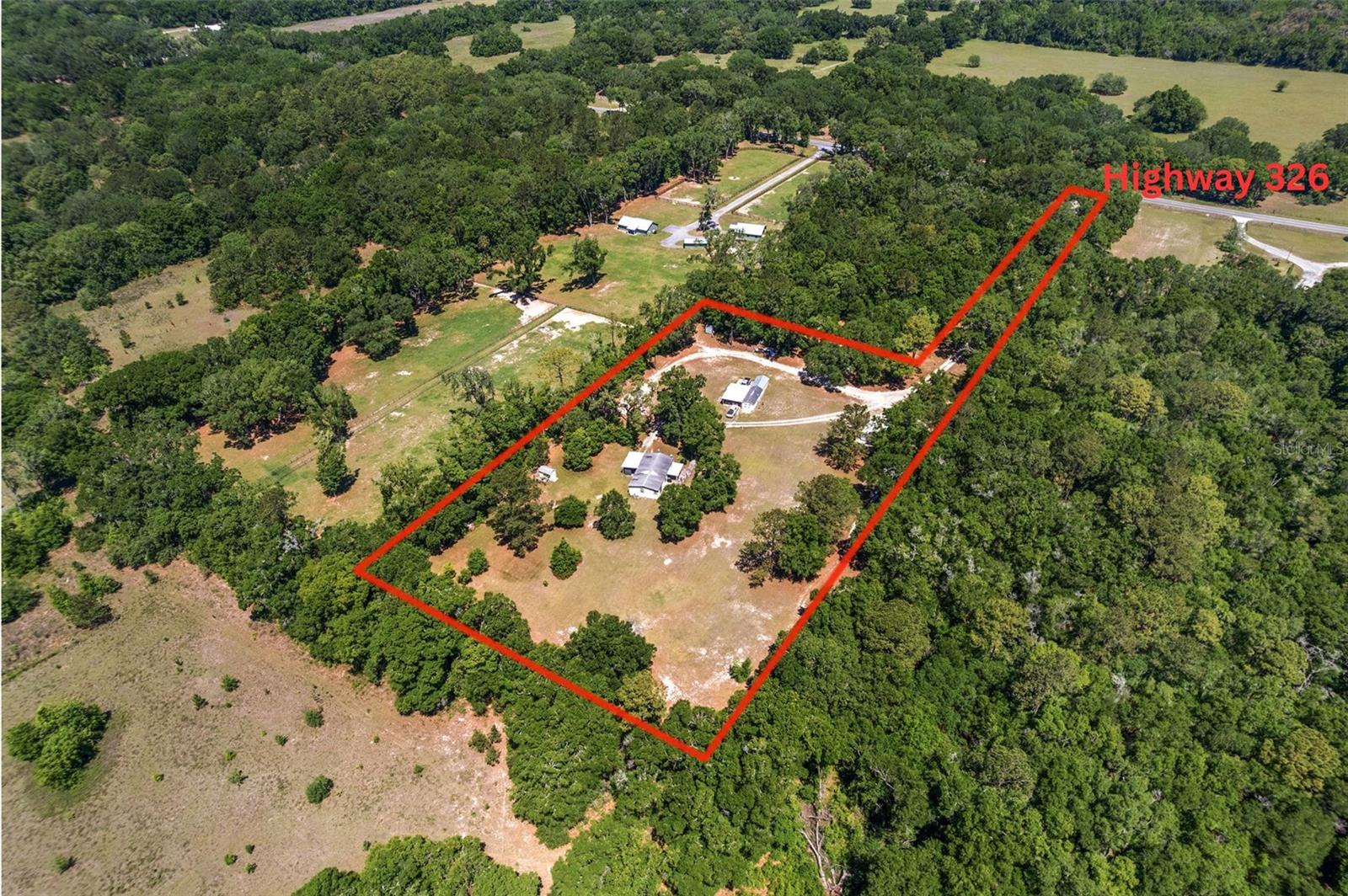 This serene 6-acre parcel offers a rare opportunity in an exceptional location with direct access off Highway 326 and just minutes from I-75. The property features a beautiful entrance lined with mature azalea trees that create a breathtaking display when in bloom. Located only 15 minutes from the World Equestrian Center, 15 minutes to downtown Ocala, and just 35 minutes to Gainesville, it also sits near the future site of the world’s largest Buc-ee’s—adding even more value to its location. This parcel is ideal for current development or as a strategic land banking investment for future growth. It also serves as a key access point to two adjoining parcels that are also available for sale—a 70-acre and a 30-acre parcel—which can be combined for a total of 100 acres. With power already run to the property and endless potential, this is a unique opportunity.