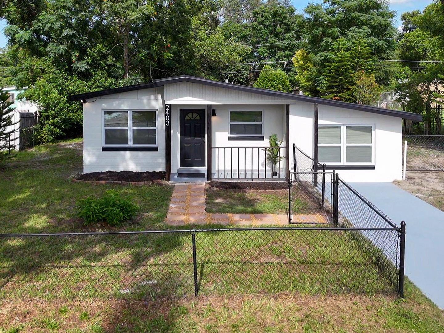 One or more photo(s) has been virtually staged. Welcome to 2403 Nansen Ave - a completely remodeled, turn key home offering modern finishes in a well thought out interior design. No HOA, fenced in property. New roof installed 6/25. Spacious and updated Kitchen, with NEW shaker soft-close cabinets, NEW quartz countertops and a NEW appliance package. NEW LVP flooring throughout the home, with NEW Tile in the bathrooms and laundry room. Two separate living areas. Updated plumbing and updated electrical throughout. New recessed lighting and fixtures as well. Newer HVAC 2023, along with new mini-split system and updated windows. New ceiling fans and fixtures throughout. Brand new tile backsplash in the kitchen. Large laundry room with new cabinets and butcher-block countertop. Large fenced yard with a newer exterior patio, new interior and exterior paint. This house is move-in-ready and priced to sell! Motivated Seller offering closing cost assistance/rate buy with negotiated terms. Incentives available— Located just off Colonial Drive with easy access to SR-408/417 and major arterial roads, 2403 Nansen Ave is minutes from Waterford Lakes Town Center’s shops, dining, and entertainment—plus nearby Blanchard Park and top-rated schools. It’s also incredibly convenient for UCF, with the campus just a short drive away.
