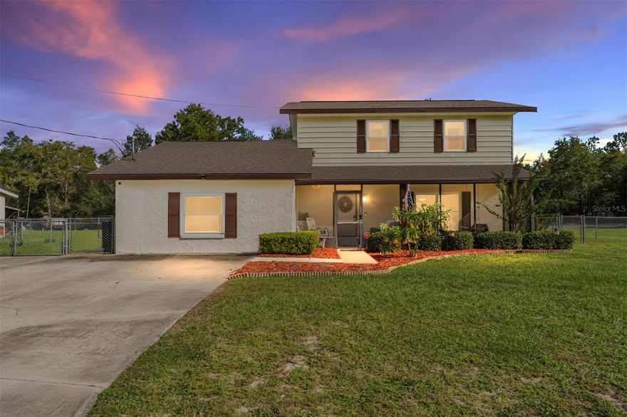 Beautiful, MOVE-IN READY 4/2 POOL home with DEN on a corner lot with fenced back yard. Lovely screened front porch with porch swing.  Primary bedroom is on the first floor with 3 bedrooms/1 bathroom upstairs.  Bedroom 2 has glass sliders with a balcony.  Granite countertops in kitchen with newer appliances.  Dining room has glass sliders to patio outside. Awesome back porch/sun room to enjoy this cooler weather!  Gorgeous in-ground pool for fun on sunny days!  10x16 storage shed with 2 inside lofts for extra storage.  Great location - approx 2 miles to Walmart, Publix, Aldi. Don't miss this one!  ROOF 11/2024. HVAC 2021.