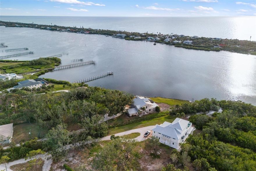 Lemon Bay | Where Waterfront Meets Estate Living  

Some properties are meant for something greater. Set on 2.41 acres with over 360 feet of open Lemon Bay shoreline, this rare offering invites you to build an estate home of distinction—one that reflects your values, your lifestyle, and your sense of place.

From the moment you arrive, the setting speaks to you. Privately tucked beneath mature canopy trees, the land feels timeless—balanced, serene, and ready to frame an extraordinary residence. With no mangroves along the water’s edge, the bay is fully revealed, offering expansive views, direct access, and the kind of coastal presence that defines true estate living.

Here, you’re not confined by limits—you’re inspired by potential. Design a main residence that flows effortlessly to outdoor entertaining spaces, a pool terrace, gardens, or a private dock. Consider a guest house, carriage garage, or studio retreat. The scale and setting support your vision—whether it's classical architecture, modern design, or a blend uniquely your own.

Just over a mile from Manasota Beach, and a short drive to private golf, marinas, and executive airports, this location offers privacy without isolation. An existing structure on the property can be removed or reimagined as part of your long-term plan.

This is more than a homesite. It's the beginning of an enduring legacy. A rare opportunity to build an estate home on the bay—refined, private, and deeply personal.