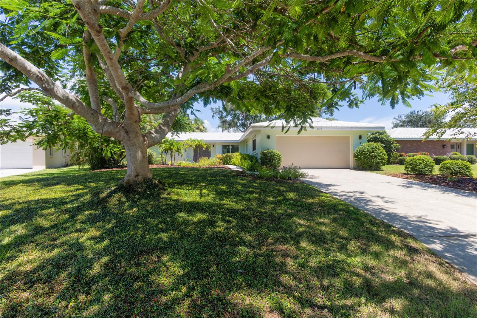 Beautifully Updated GOLF COURSE Frontage Home with the ABSOLUTE BEST LOT and BEST Panoramic GOLF COURSE VIEWS in all of Village Green Club Estates! This Lovely HOME FEATURES: 3 Bedrooms, 2 Baths, 3rd Bedroom makes a perfect Den/Flex Room, Master Suite w/Updated Private Bath w/Granite Counters, Walk-in Closet w/Built-ins plus Slider to Covered Lanai, Open Living Room w/Gorgeous Private Panoramic Golf Course Views, Formal Dining Area, Family Room Area, Updated Kitchen w/Granite Counters and Eating Bar, Stainless Appliances, Pantry Closet; Breakfast Nook w/Slider to Screened Lanai, Updated Hall Bath w/Tub and Granite Counters, HUGE Laundry Room Large Enough to be Used as an Office, House Re-Plumb, Updated w/Windows w/Hurricane Shutters, AC and Hot-Water Heater less than 3 Years Old, Porcelain Tile in all areas except the Master Suite and One Guest Bedroom, Oversized 2 Car Garage, Private Paver Patio Shaded by a Majestic Oak Tree and Designer Landscaping w/Irrigation. COMMUNITY FEATURES: Golf Clubhouse is Close-by. NO CDD Fees plus SUPER Low $100 Annual HOA Fees! This is a Fabulous Location close to Everything - Publix Grocery Store, Walmart, Walgreens, Starbucks, Legacy Bike Trail, Downtown Sarasota Restaurants, I-75, UTC Mall and the Siesta Key Beaches! Seller is even including Most of the Furniture!