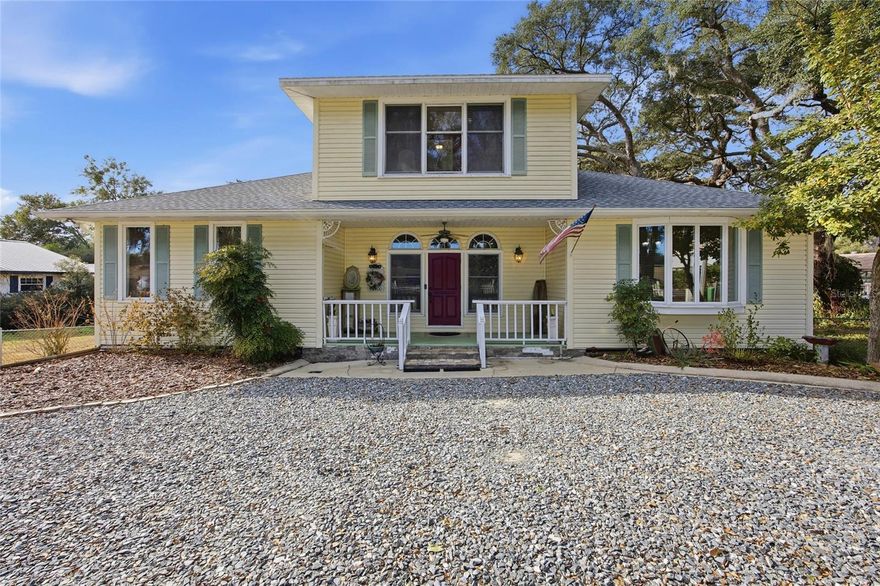 One or more photo(s) has been virtually staged. Welcome to this charming two-story lakefront home. Offering privacy, character, and resort-style outdoor living on beautiful Smith Lake. From the moment you arrive, the inviting front porch sets the tone for a warm and welcoming property.

Inside, you will find bright living spaces with large windows that bring in natural light and showcase peaceful views of the backyard and water. The home offers a functional layout with spacious rooms and timeless architectural details throughout.

The saltwater pool was converted approximately eight years ago and is surrounded by an expansive patio, perfect for entertaining or relaxing. The property also features two koi ponds and a cozy fire pit area that creates an ideal setting for evenings under the stars. The property has a seawall and dock on the private Smith Lake. 

Additional highlights include a roof replaced in 2023, lush landscaping, and multiple outdoor gathering spaces that make this home feel like a personal getaway while still being conveniently located near town amenities.