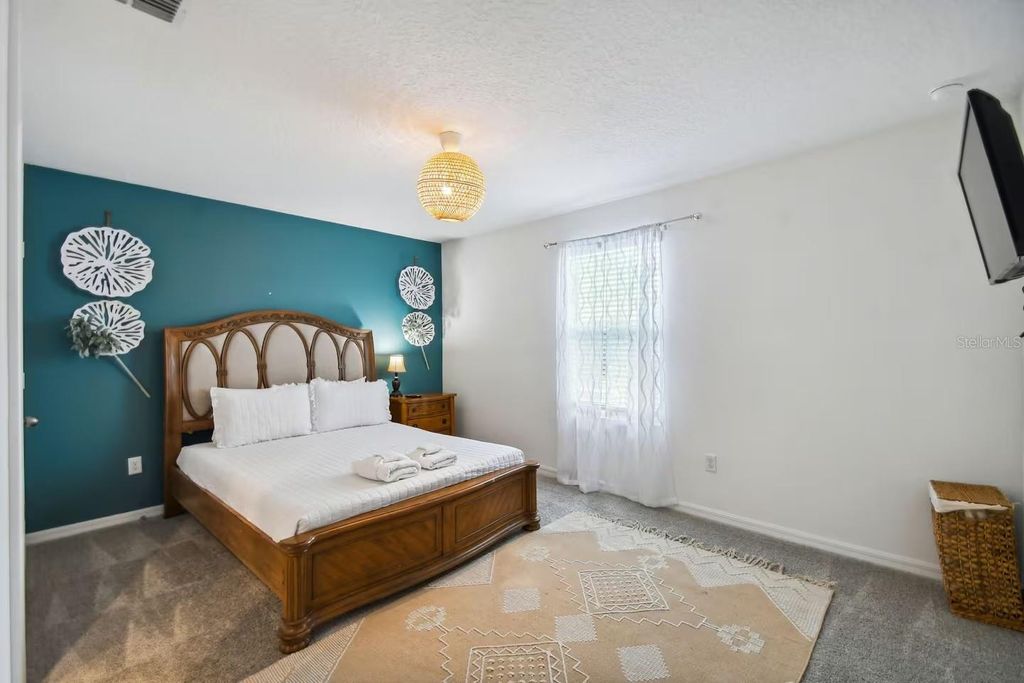 Photo of 8951 Amelia Downs Trail, Kissimmee, FL 34747 (MLS # O6411198)